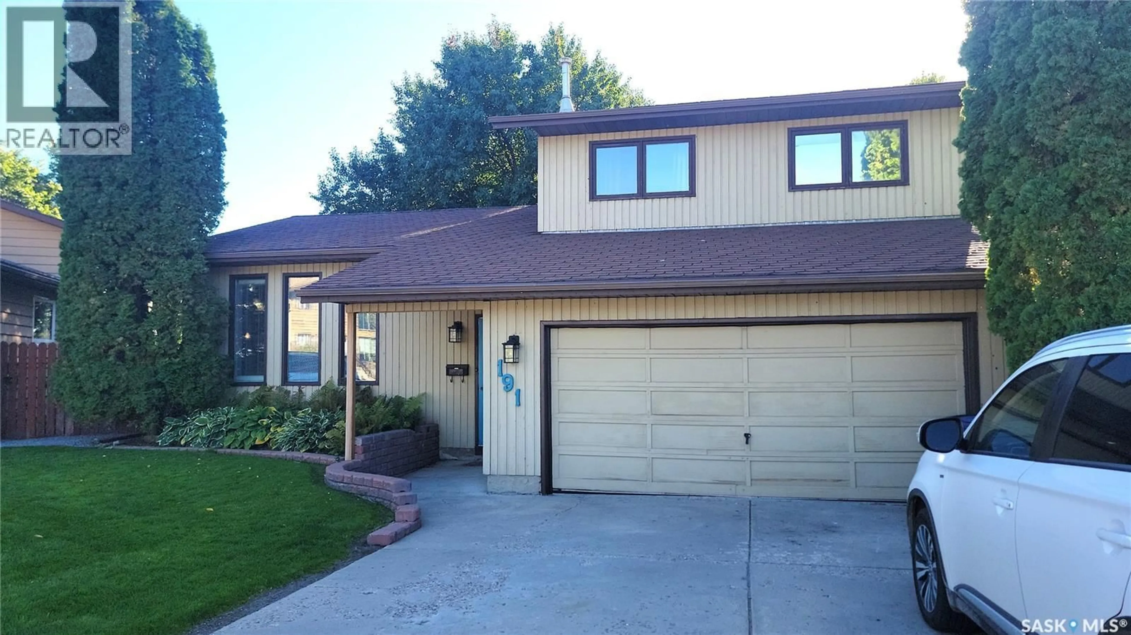 Home with vinyl exterior material, street for 191 NEATBY PLACE, Saskatoon Saskatchewan S7M4W8
