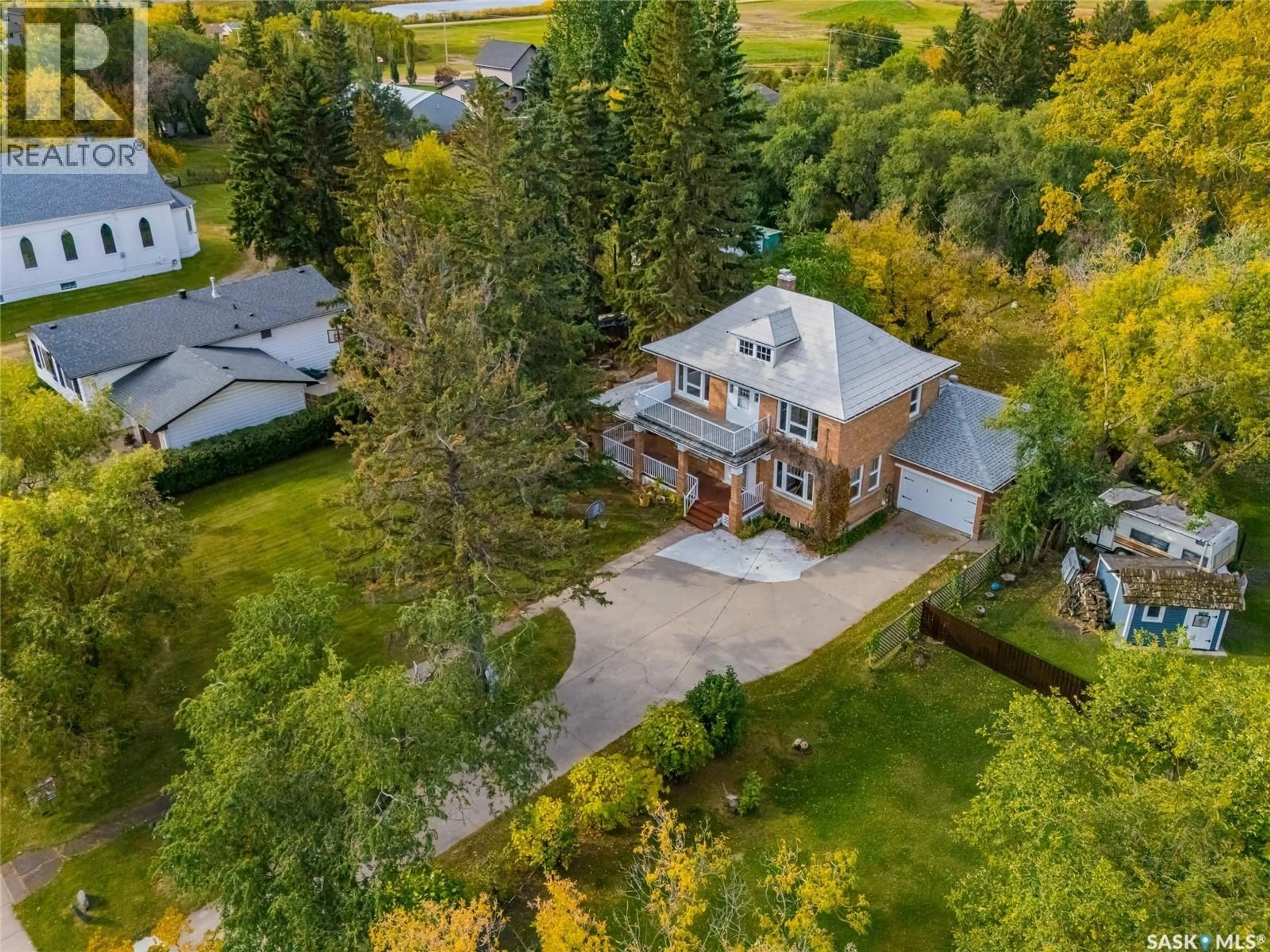 A pic from outside/outdoor area/front of a property/back of a property/a pic from drone, street for 810 4TH AVENUE, Rosthern Saskatchewan S0K3R0
