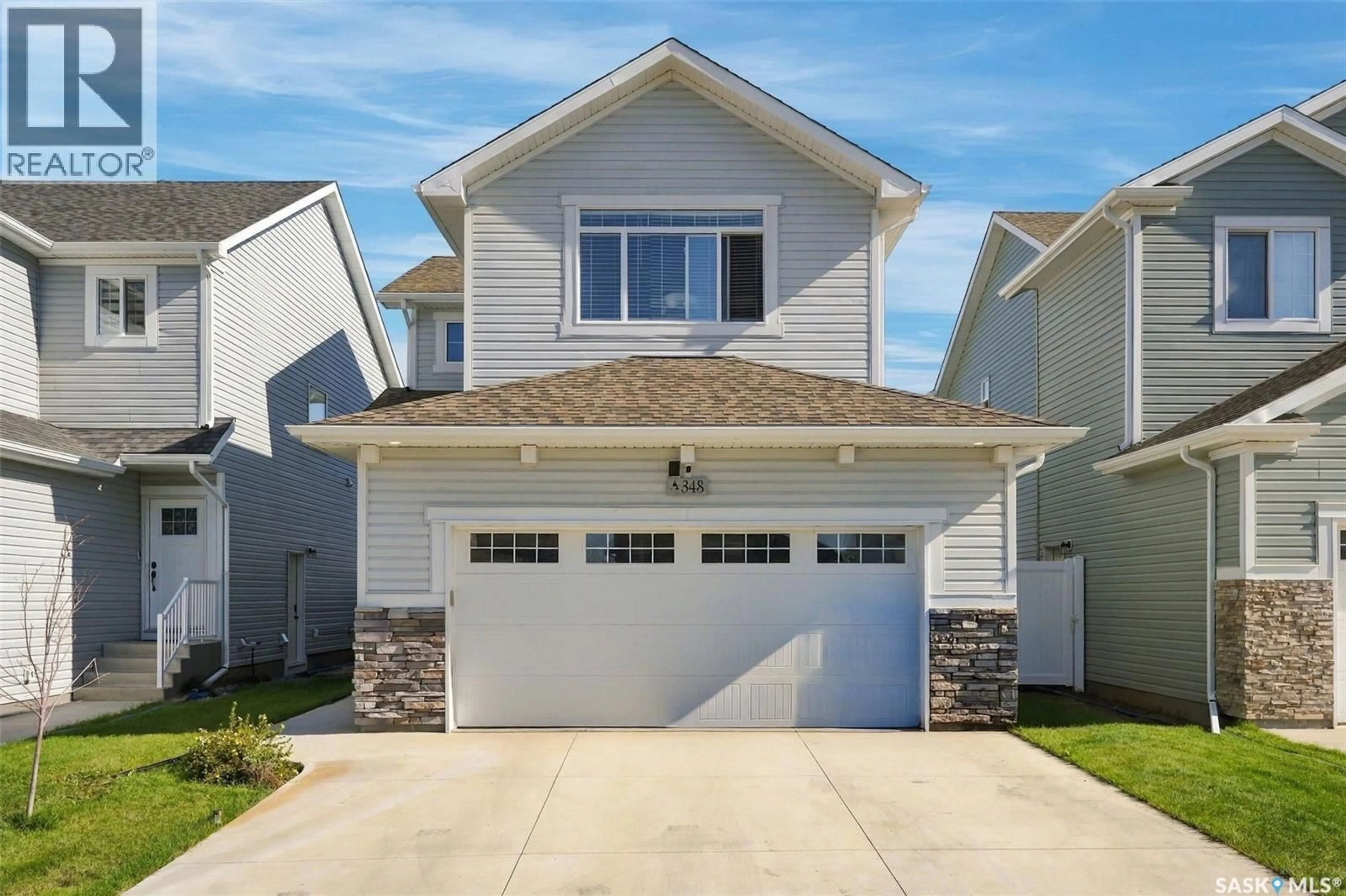 Home with vinyl exterior material, street for 348 PEPPER PLACE, Saskatoon Saskatchewan S7V1S7