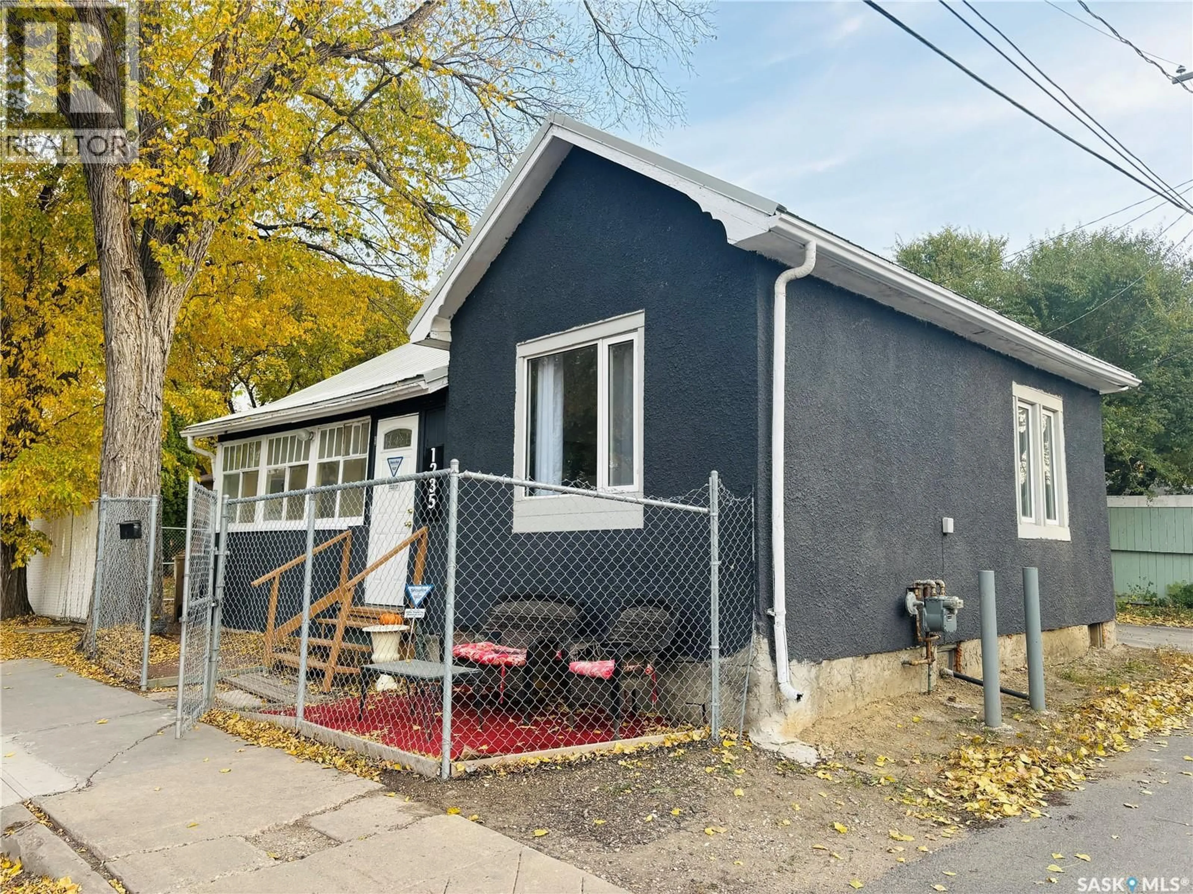 Home with vinyl exterior material, street for 1235 12TH AVENUE, Regina Saskatchewan S4P0L2