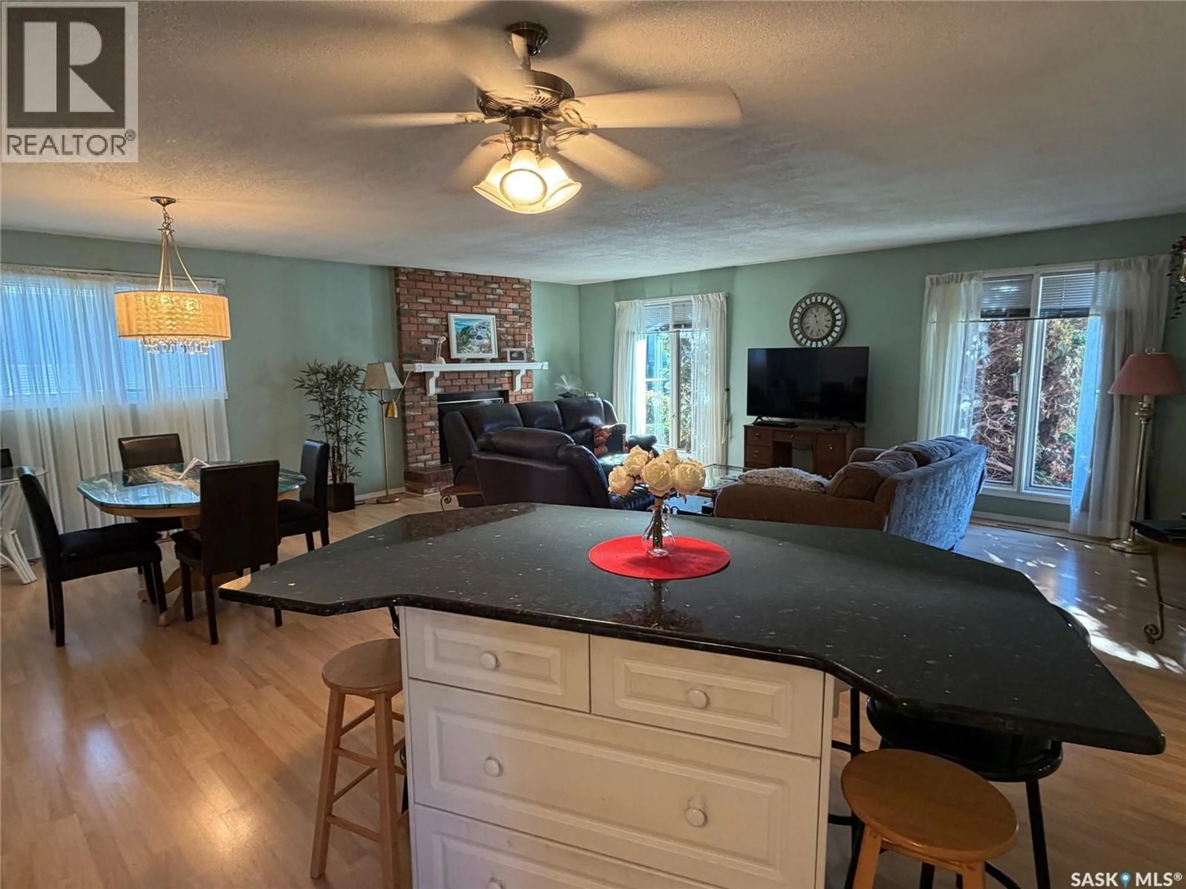 Open concept kitchen, wood/laminate floor for 422 MANNING LANE, Saskatoon Saskatchewan S7L6J8