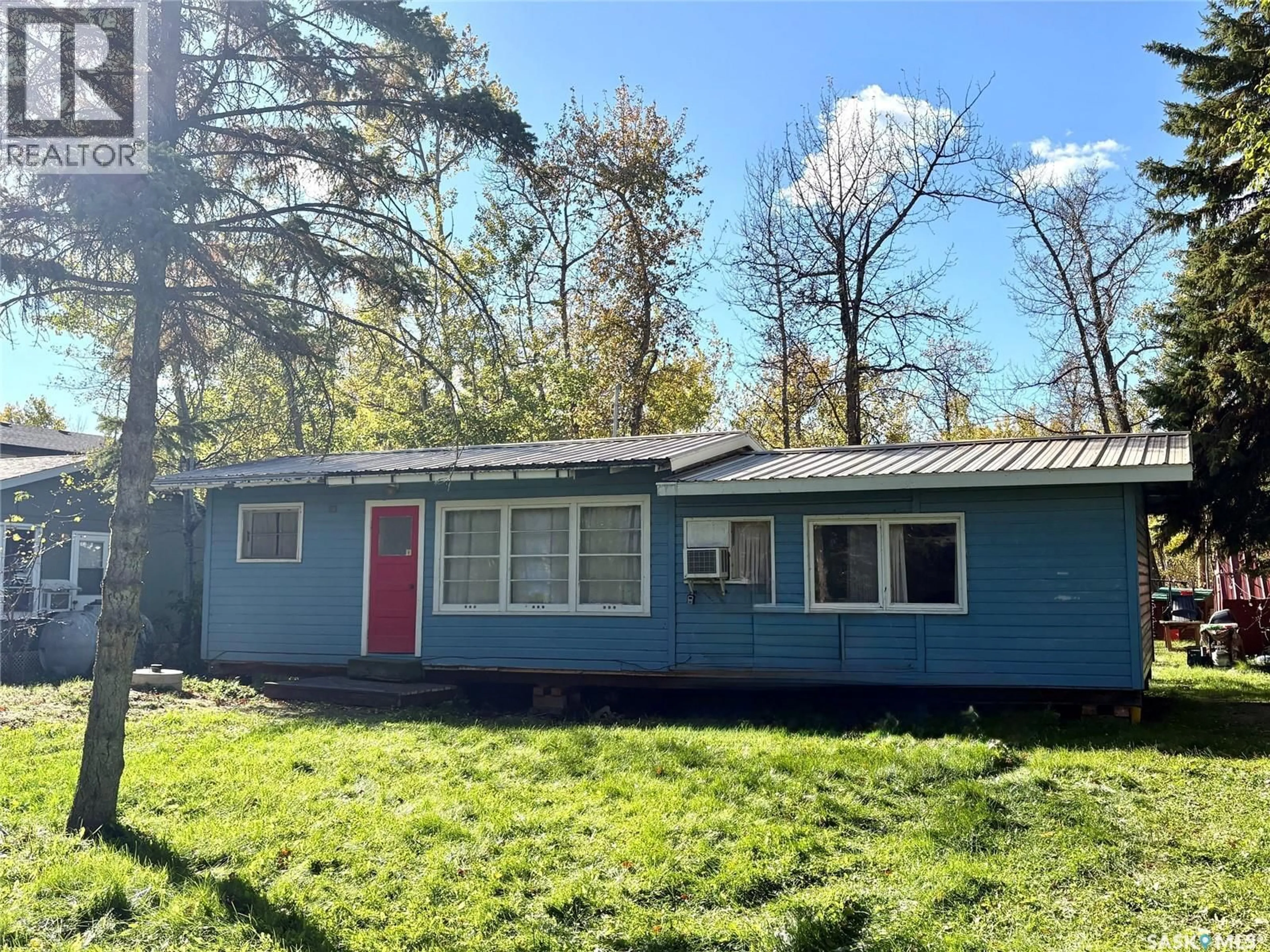 Home with vinyl exterior material, street for 15 WAKISEW AVENUE, Good Spirit Lake Prov Park Saskatchewan S0A3V0