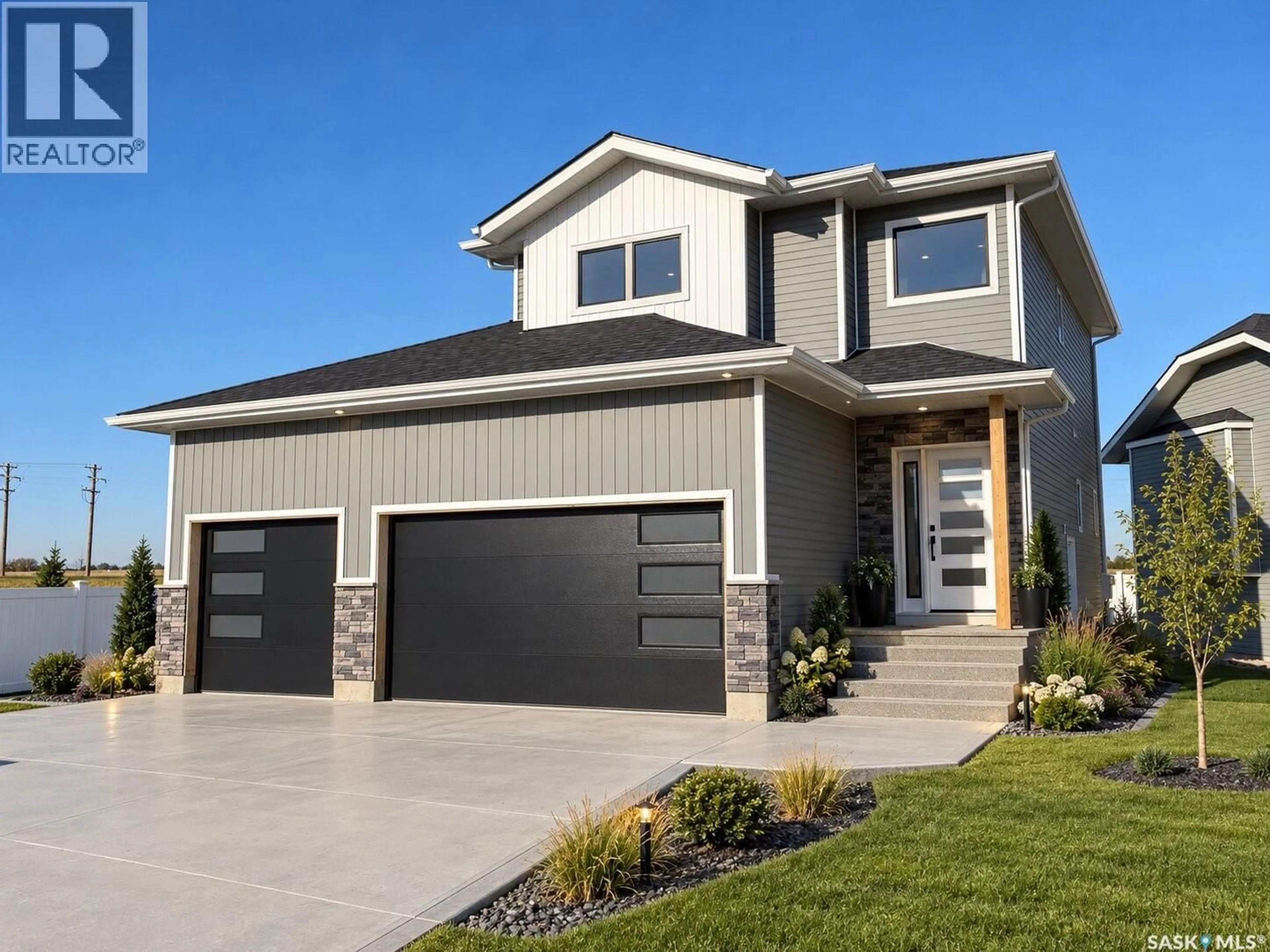 Home with vinyl exterior material, street for 802 BALLESTEROS CRESCENT, Warman Saskatchewan S0K4S0