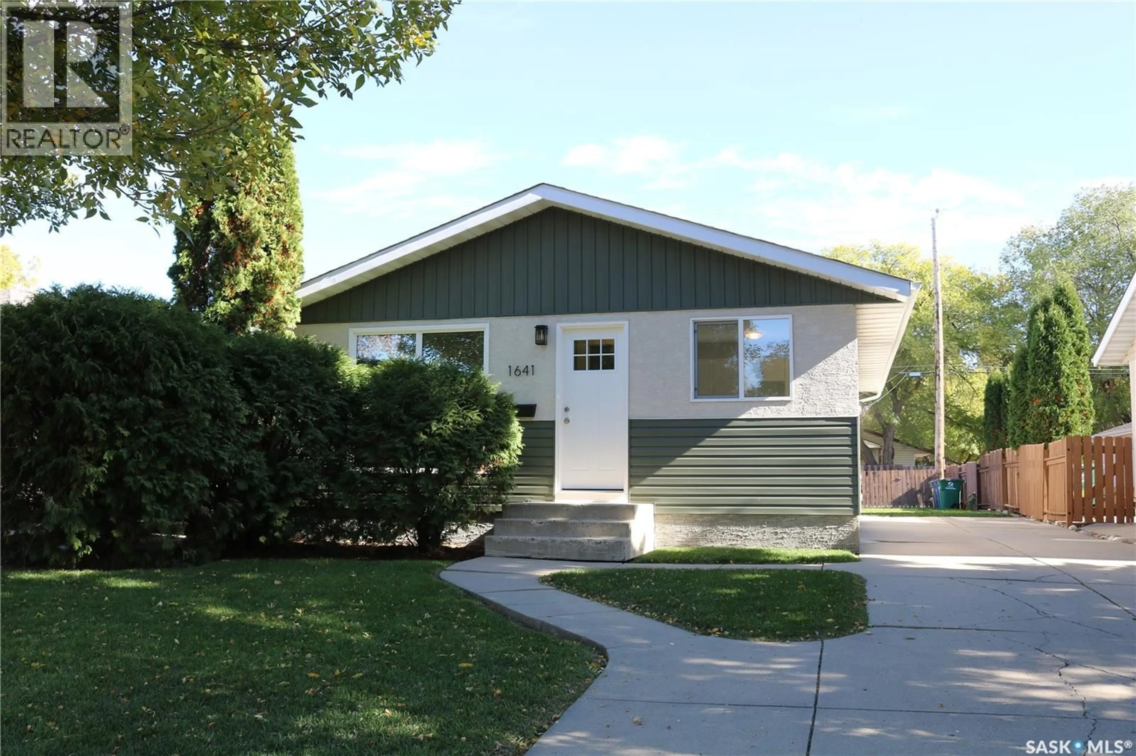 Home with vinyl exterior material, street for 1641 THOMPSON AVENUE, Saskatoon Saskatchewan S7N1Y2