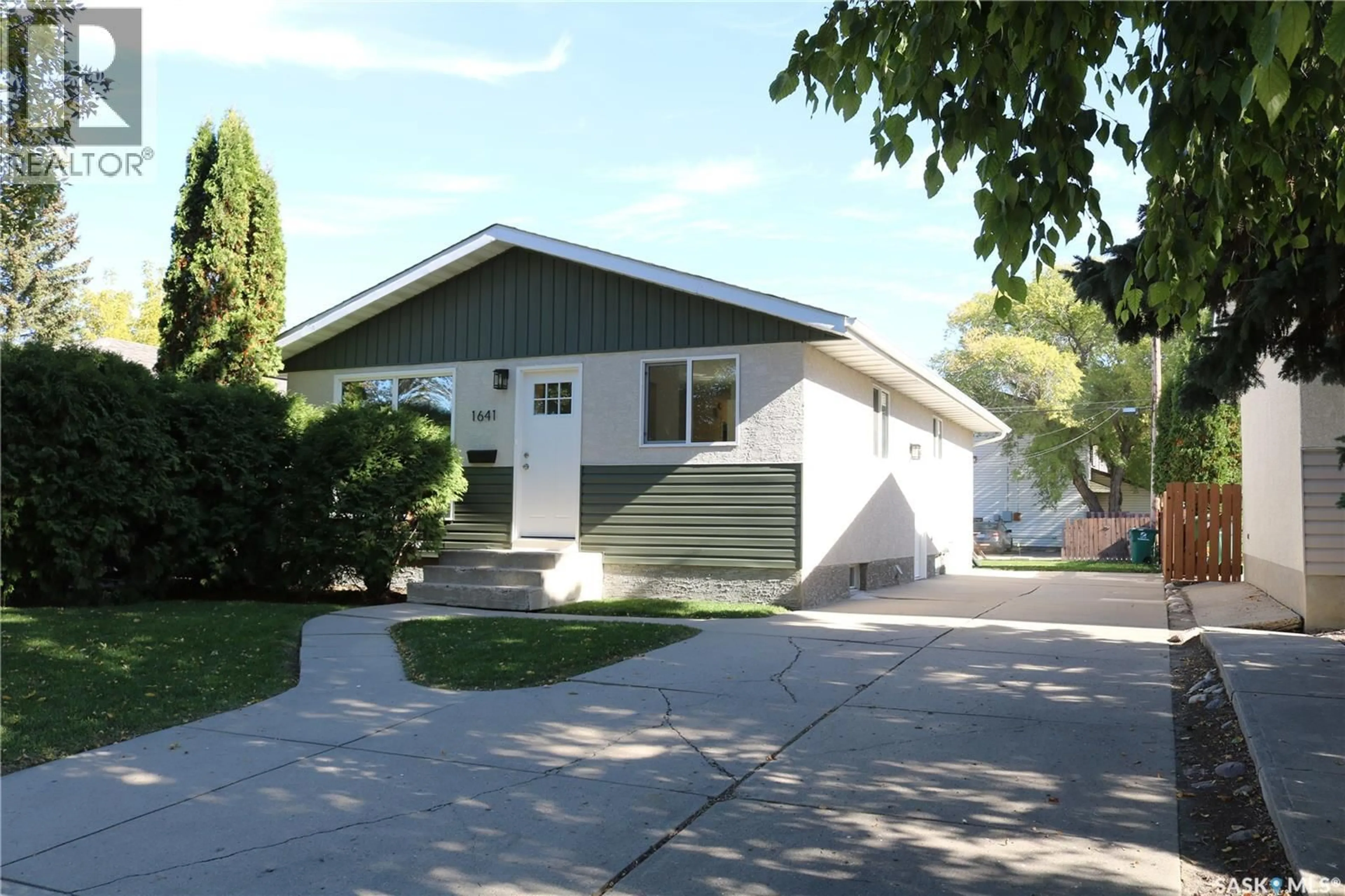 Home with vinyl exterior material, street for 1641 THOMPSON AVENUE, Saskatoon Saskatchewan S7N1Y2