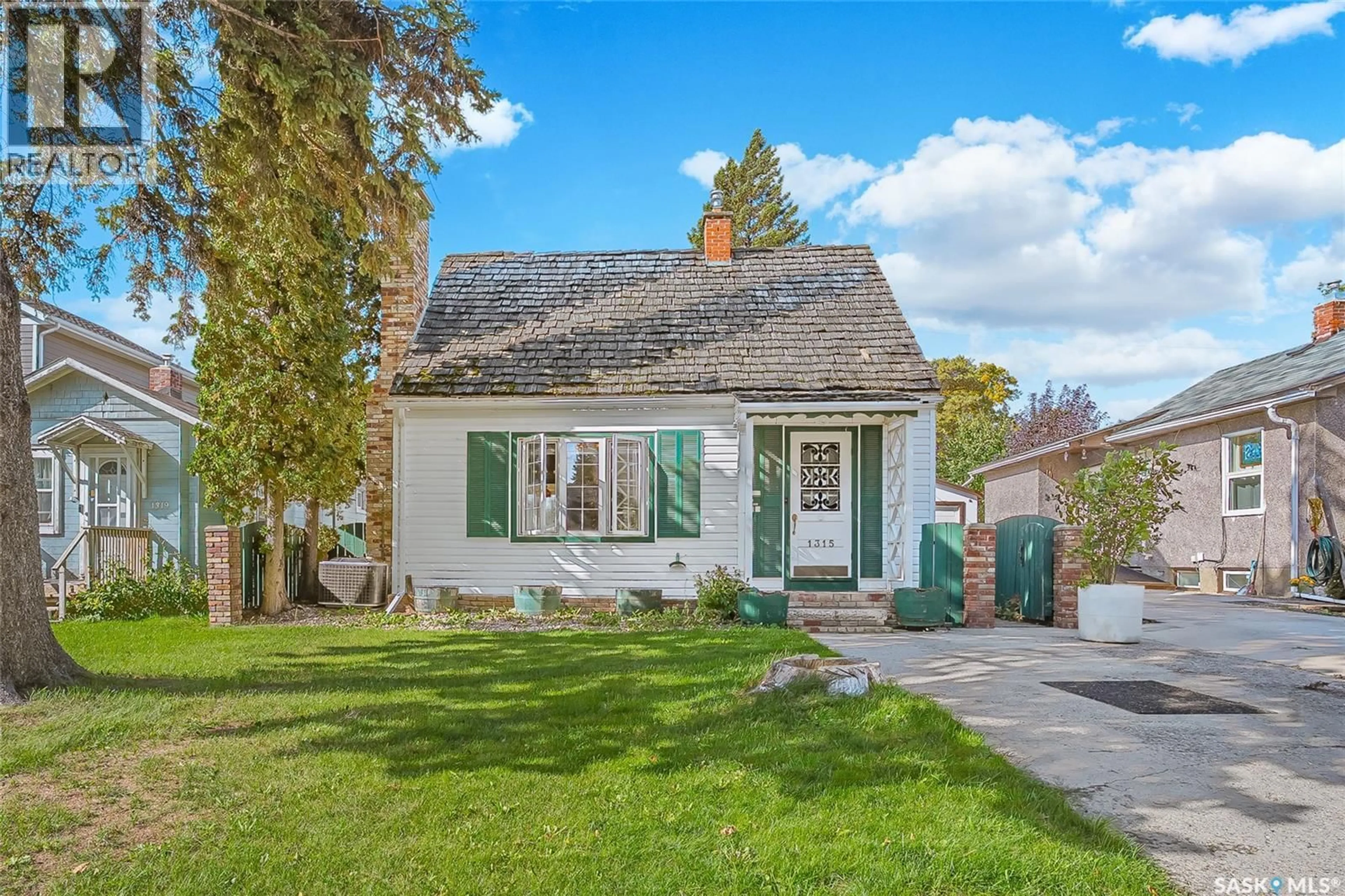 Home with vinyl exterior material, street for 1315 2ND AVENUE, Saskatoon Saskatchewan S7K3E6
