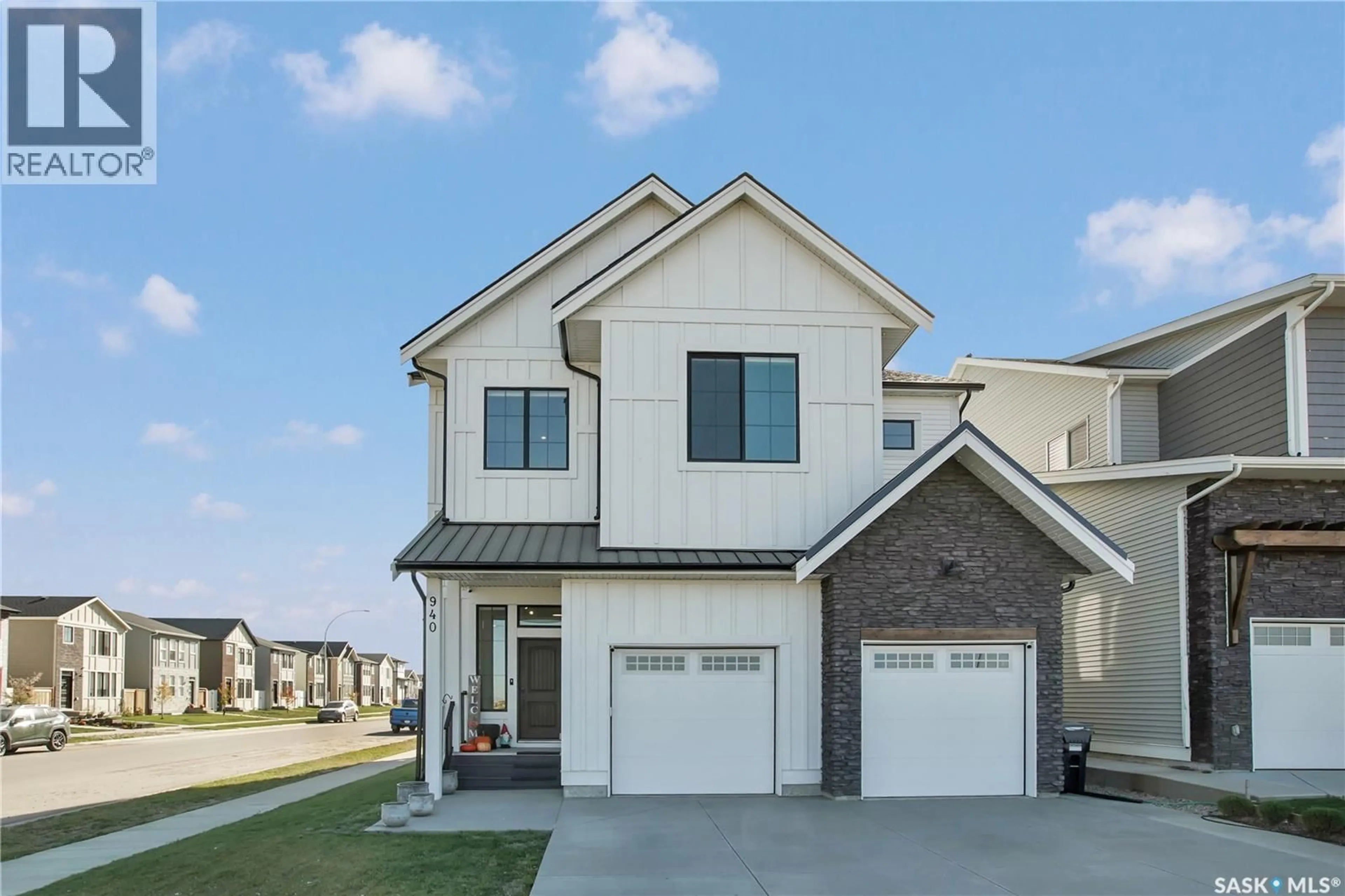 Home with brick exterior material, street for 940 FEHEREGYHAZI BOULEVARD, Saskatoon Saskatchewan S7W1E1