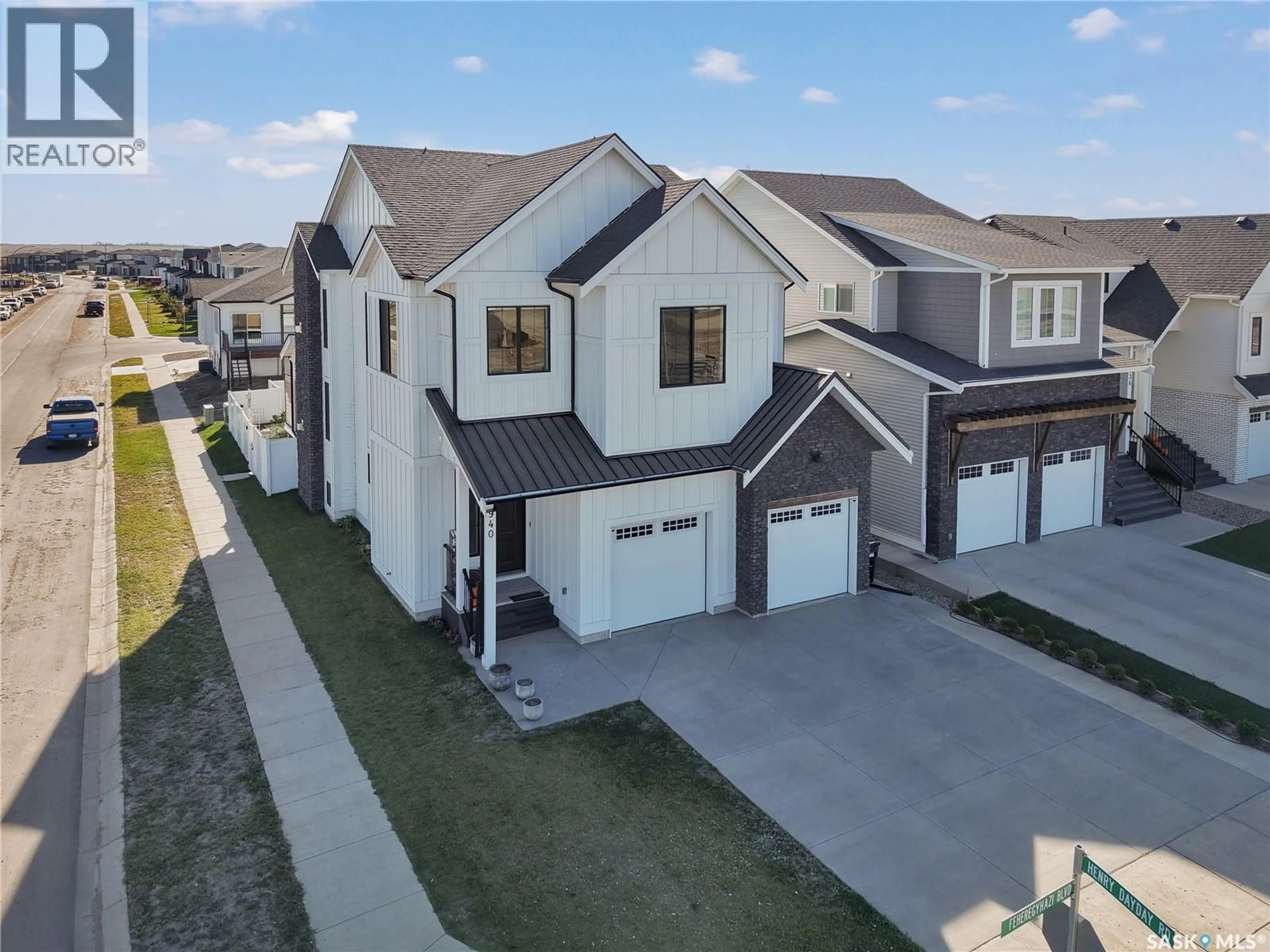 A pic from outside/outdoor area/front of a property/back of a property/a pic from drone, street for 940 FEHEREGYHAZI BOULEVARD, Saskatoon Saskatchewan S7W1E1