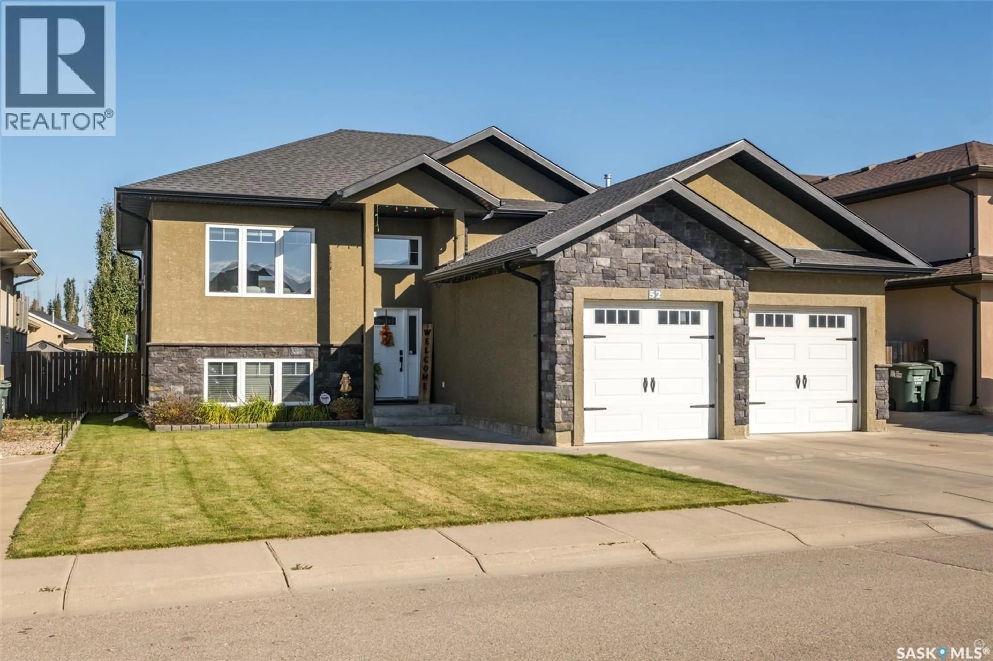 Home with vinyl exterior material, street for 52 COOMBE DRIVE, Prince Albert Saskatchewan S6X0A9