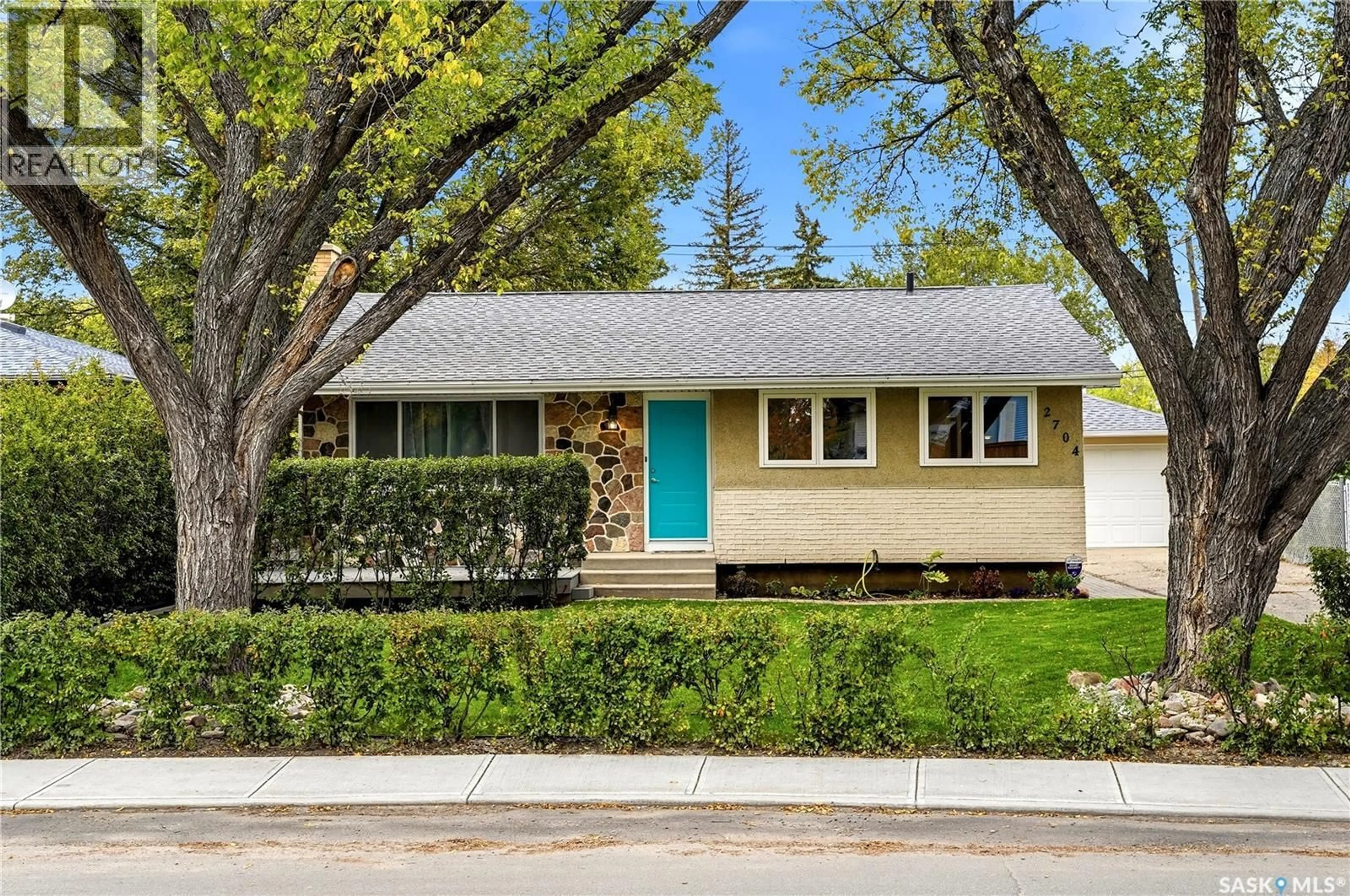 Home with vinyl exterior material, street for 2704 5TH AVENUE, Regina Saskatchewan S4R0S7