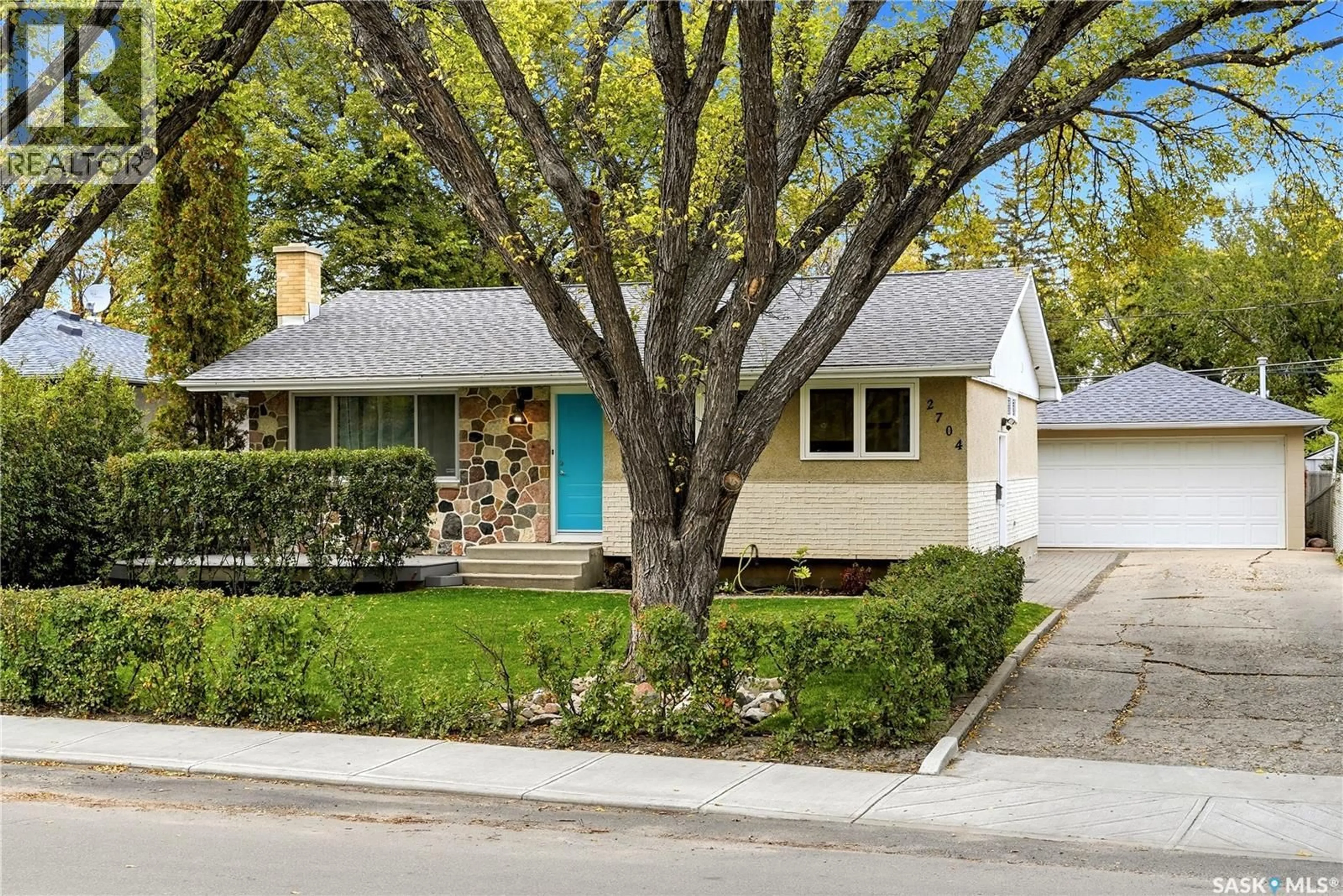 Home with vinyl exterior material, street for 2704 5TH AVENUE, Regina Saskatchewan S4R0S7