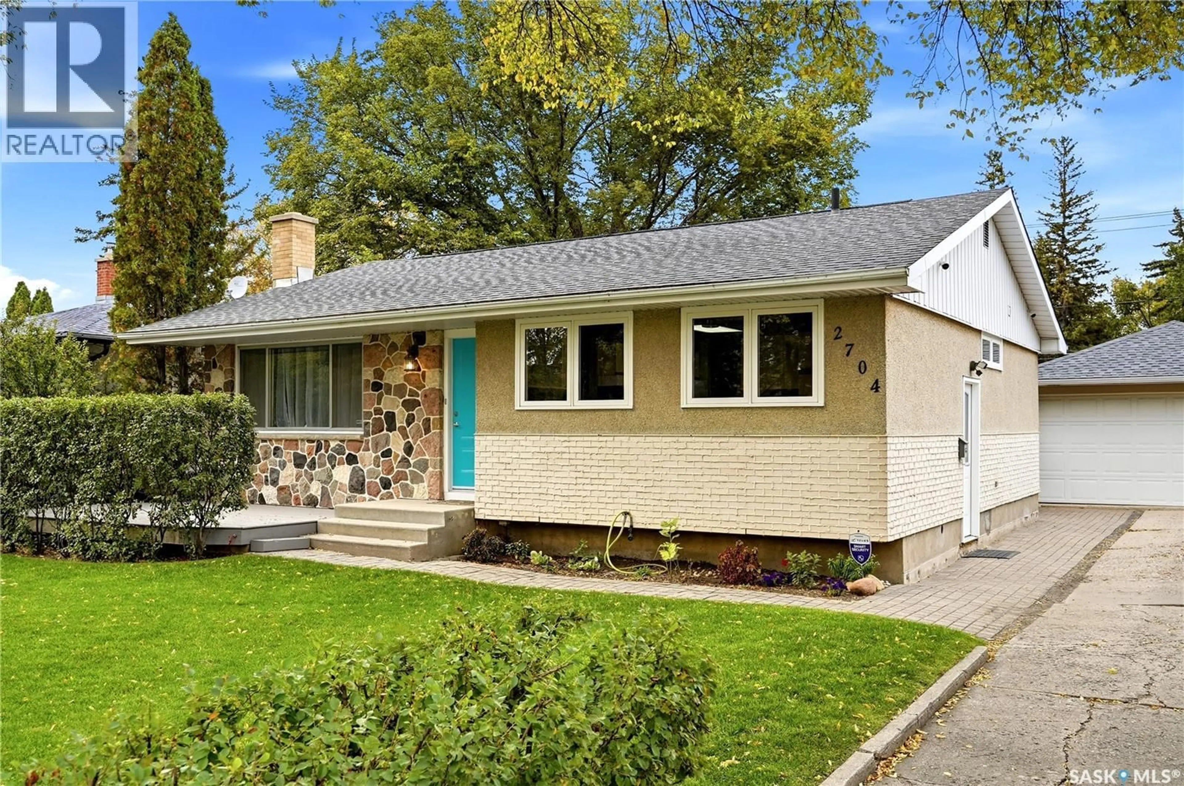 Home with vinyl exterior material, street for 2704 5TH AVENUE, Regina Saskatchewan S4R0S7