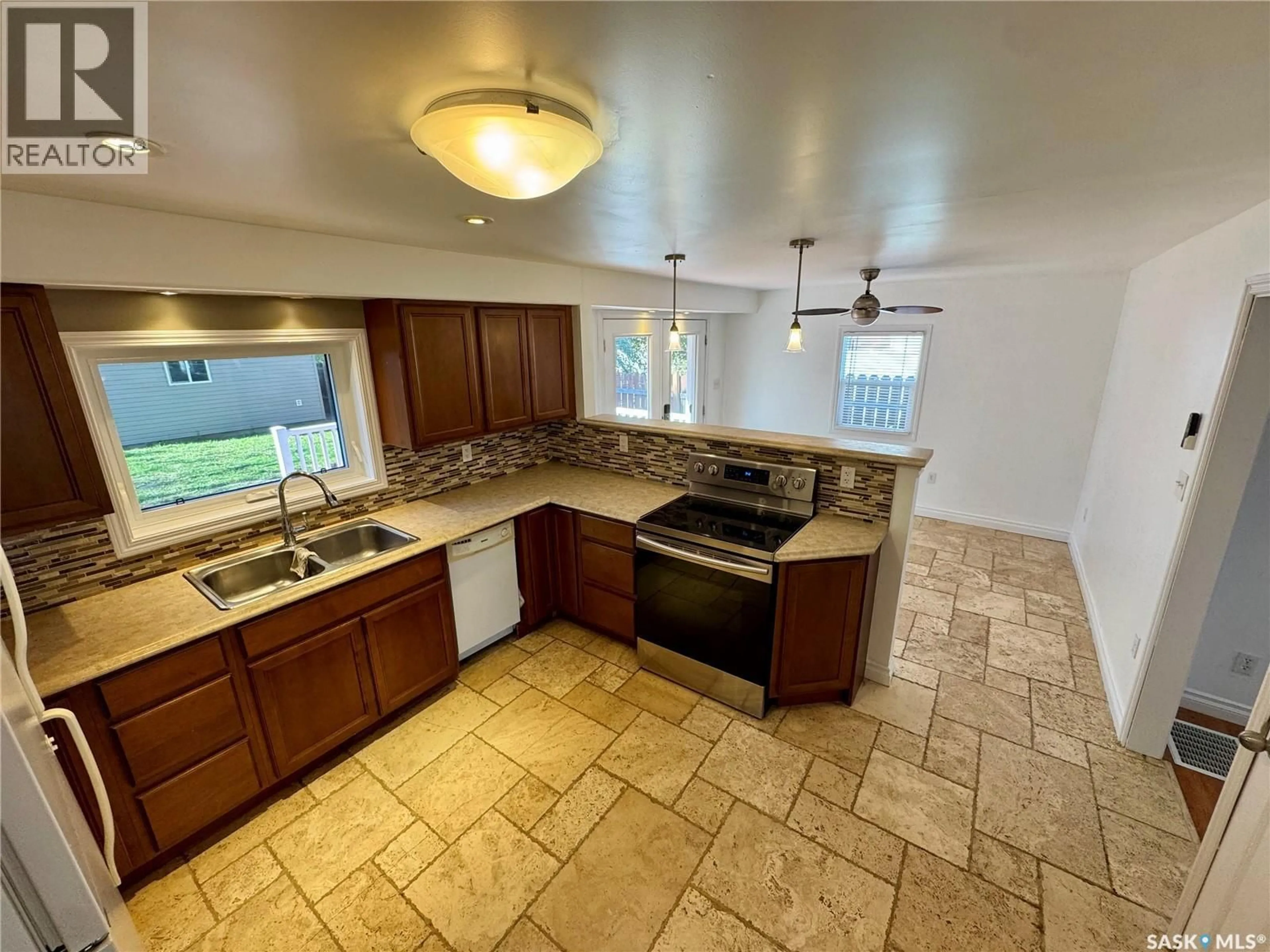 Open concept kitchen, ceramic/tile floor for 365 KEATS STREET, Southey Saskatchewan S0G4P0