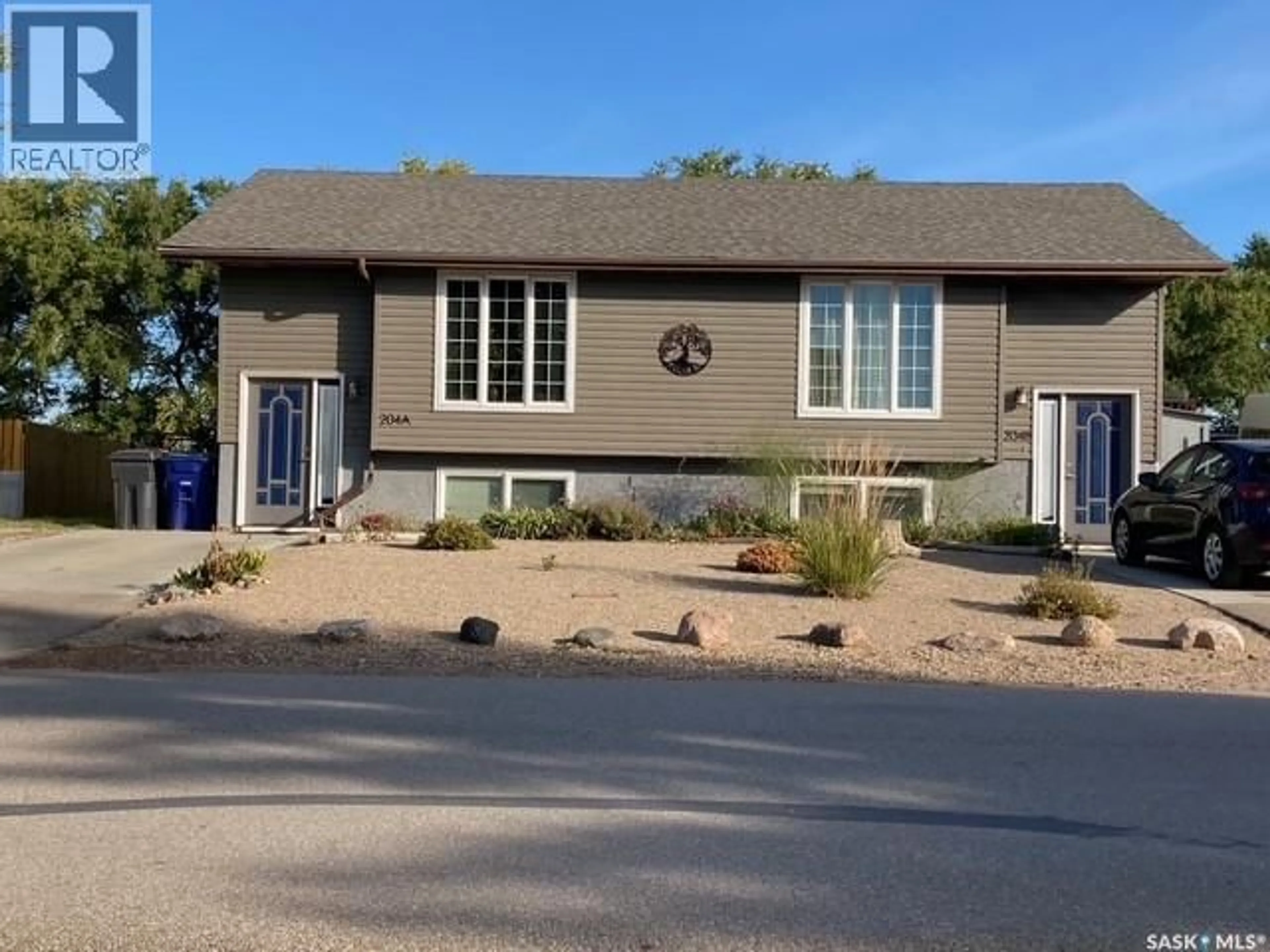 Home with vinyl exterior material, street for A & B - 204 5TH AVENUE, Caronport Saskatchewan S0H0S0