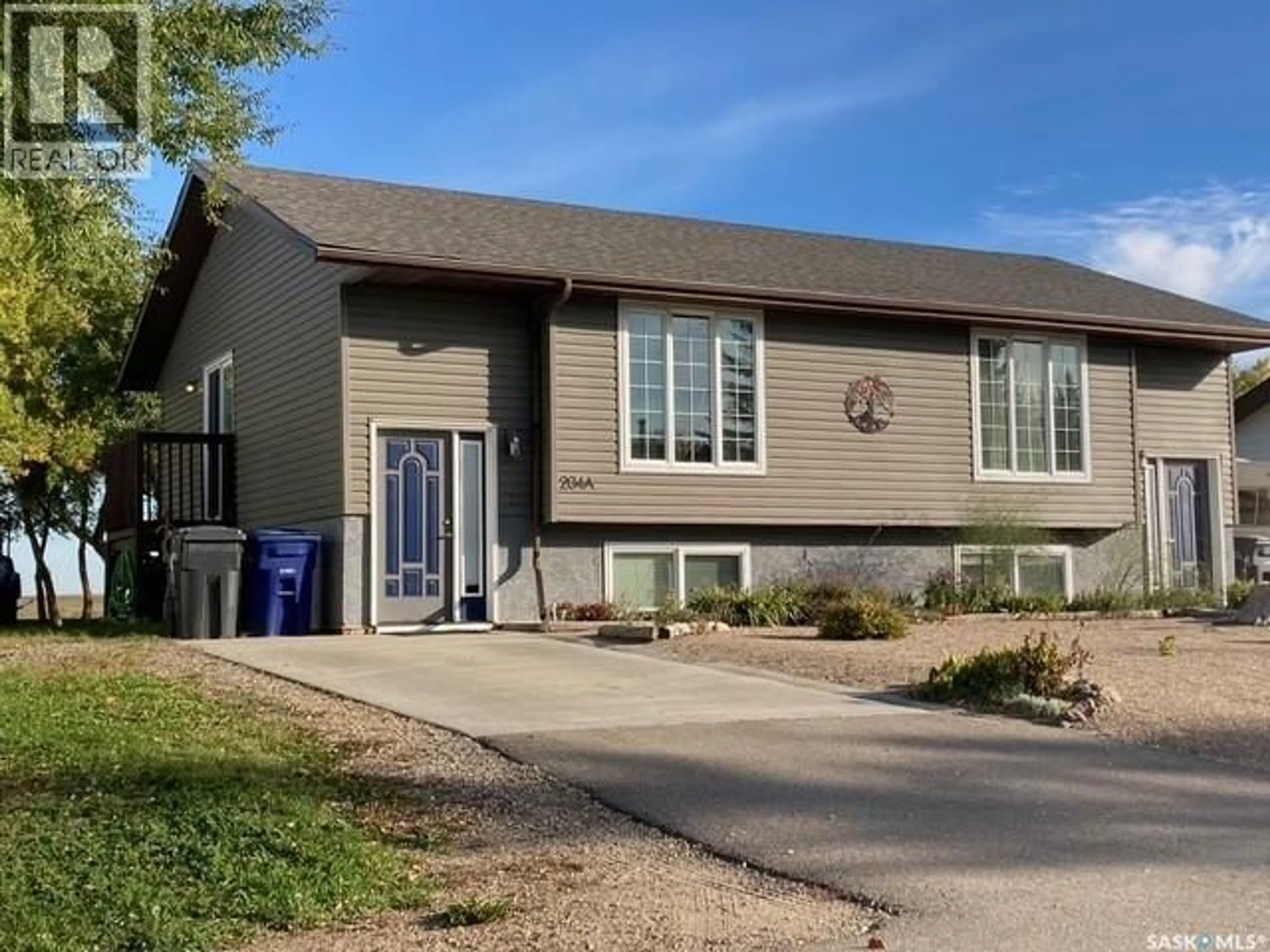 Home with vinyl exterior material, street for A & B - 204 5TH AVENUE, Caronport Saskatchewan S0H0S0