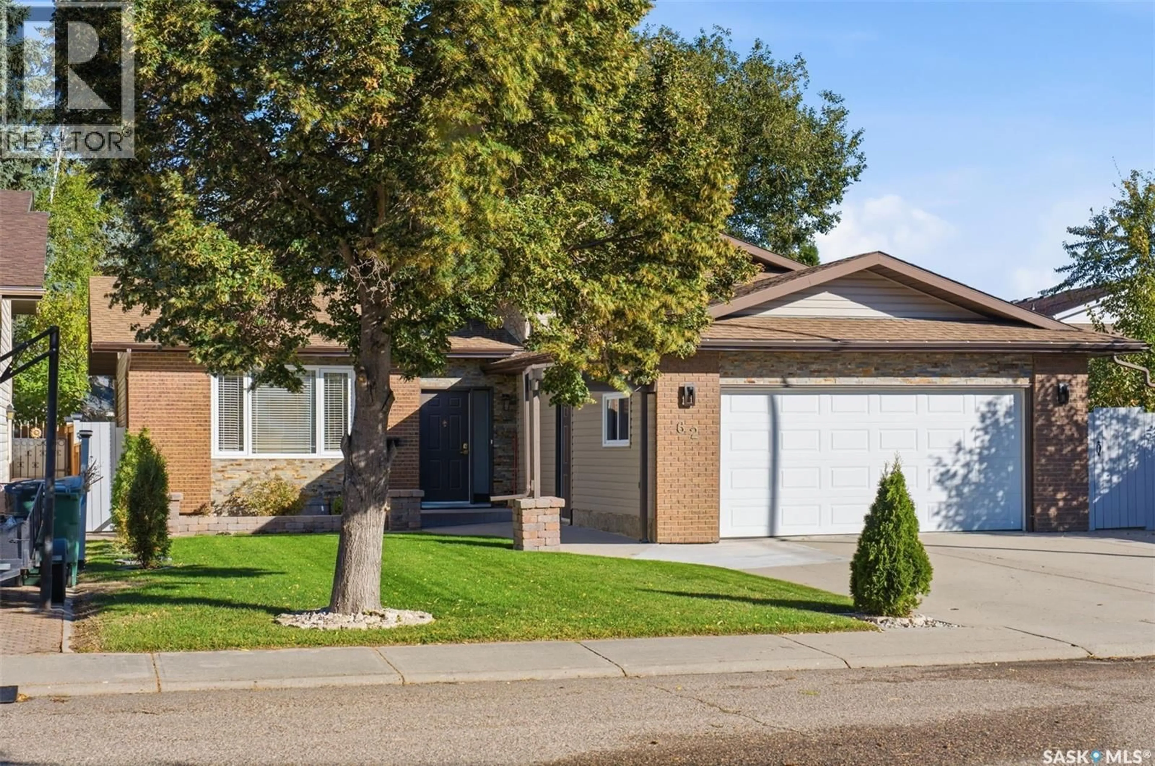 Home with vinyl exterior material, street for 62 CHOMYN CRESCENT, Saskatoon Saskatchewan S7K7R5