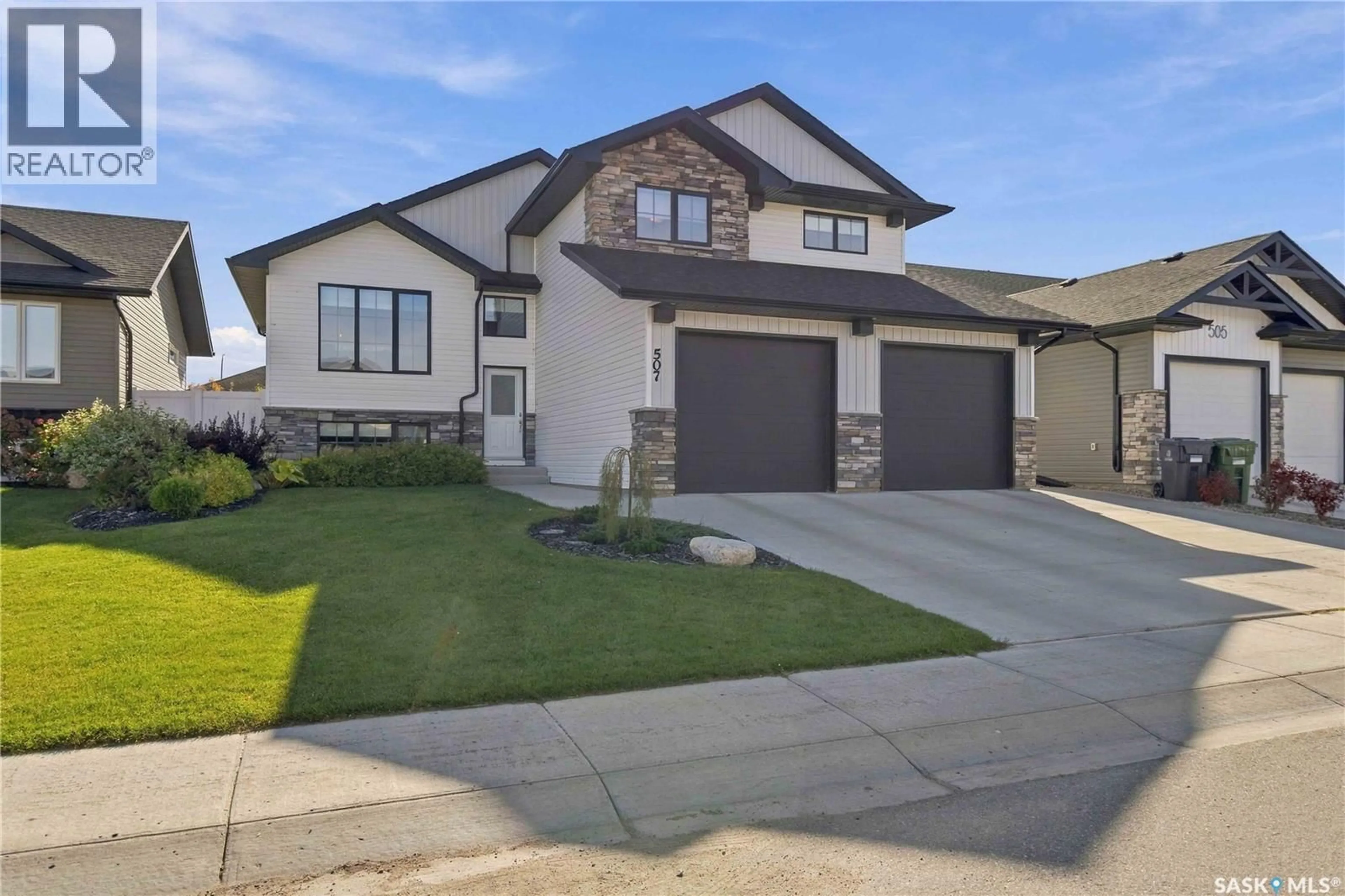 Home with vinyl exterior material, street for 507 CABRERA WAY, Warman Saskatchewan S0K4S1