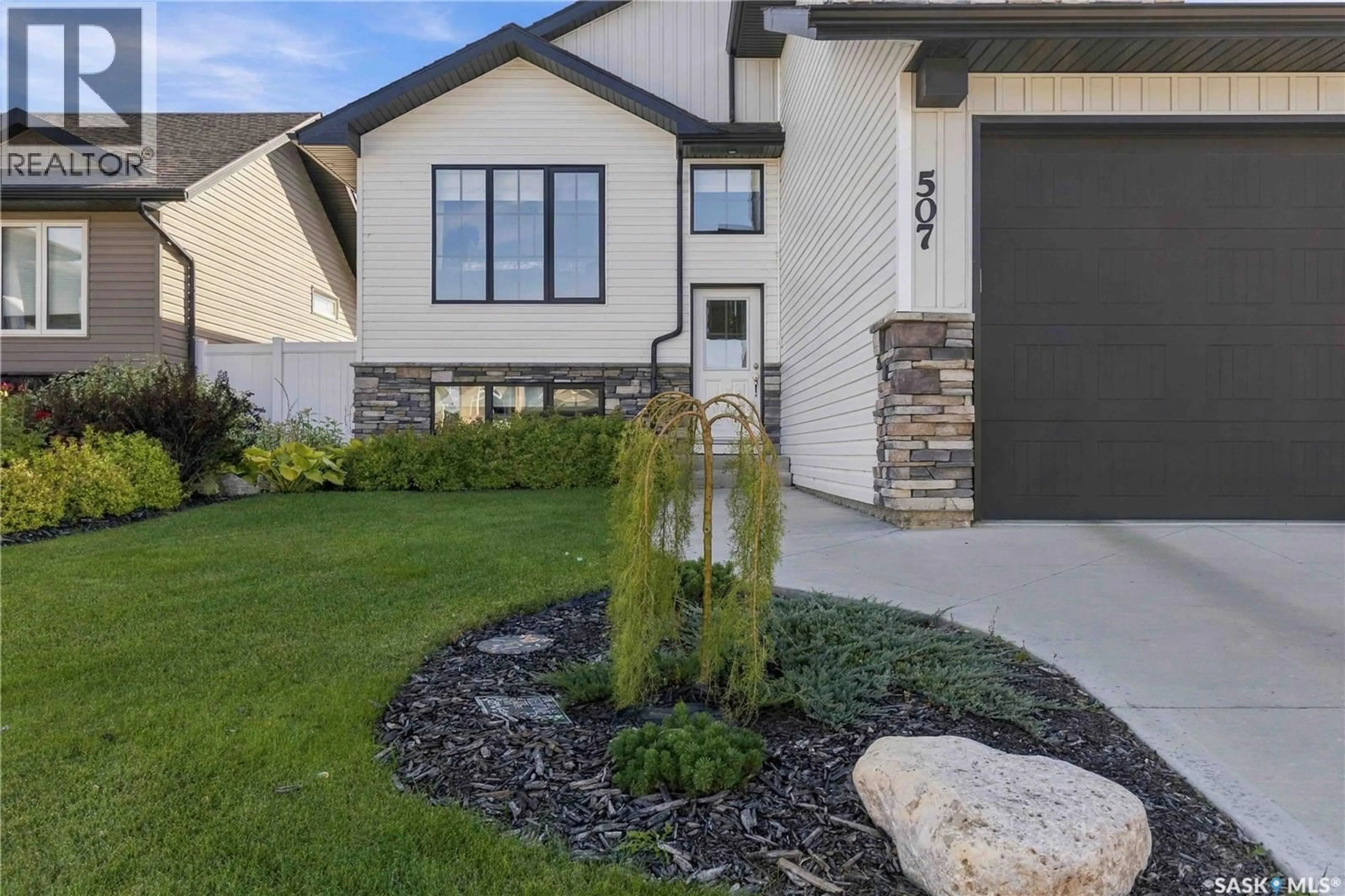 Home with vinyl exterior material, street for 507 CABRERA WAY, Warman Saskatchewan S0K4S1