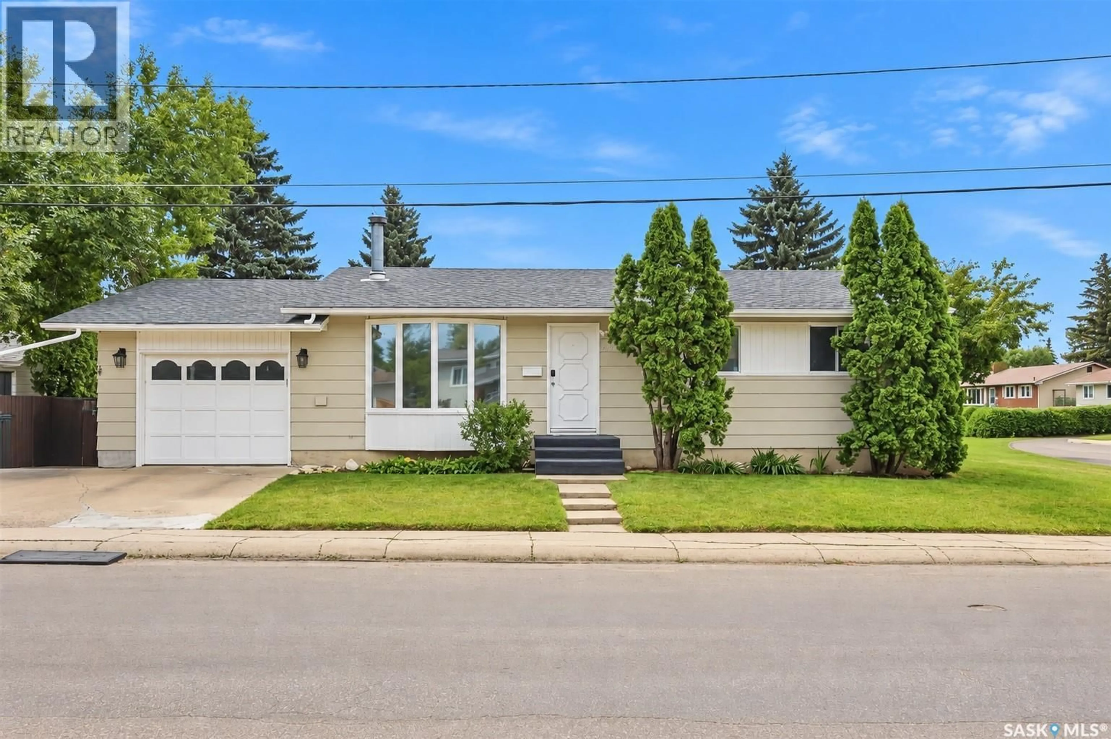 Home with vinyl exterior material, street for 1535 LAURA AVENUE, Saskatoon Saskatchewan S7N2R8
