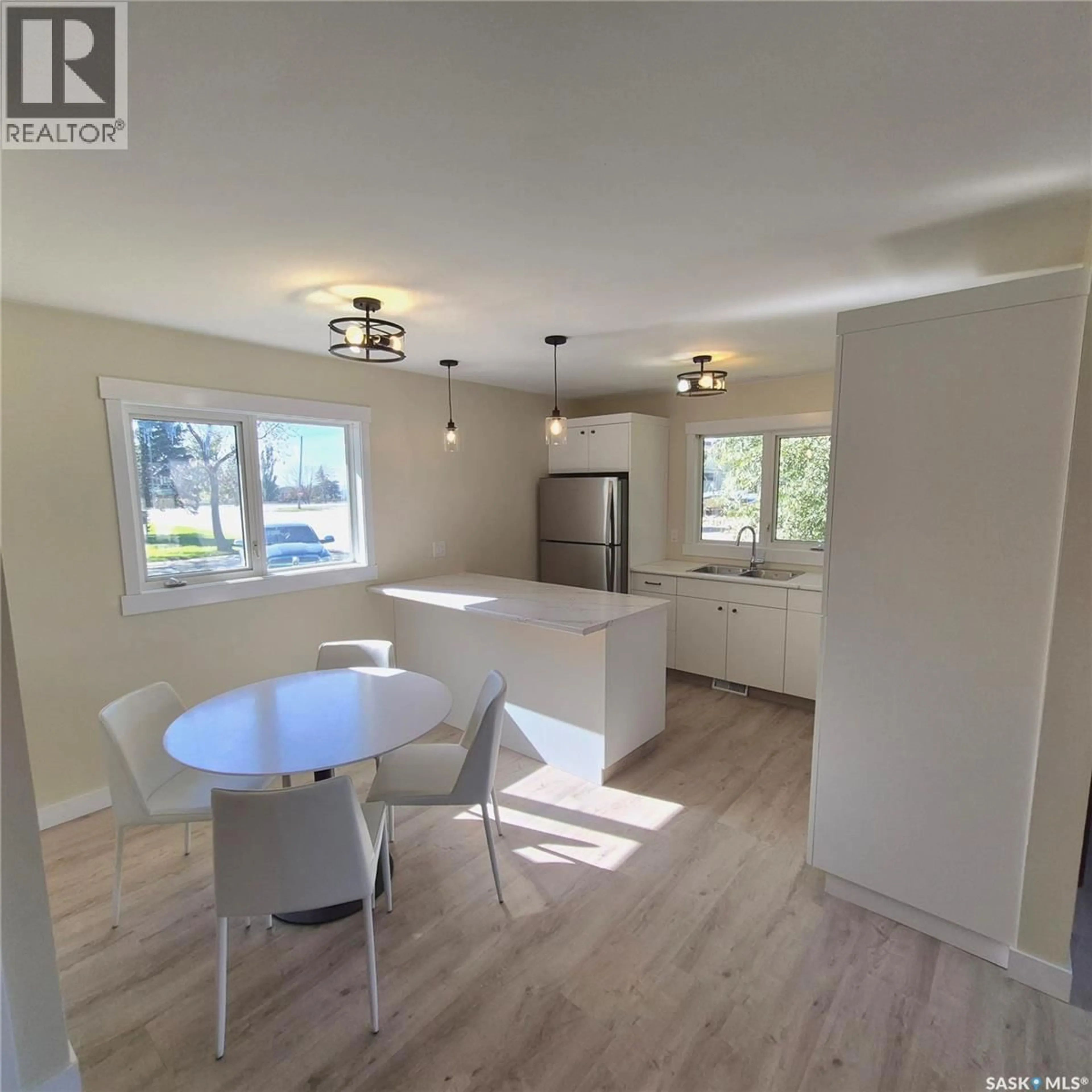 Open concept kitchen, wood/laminate floor for 801 PROSPECT AVENUE, Oxbow Saskatchewan S0C2B0