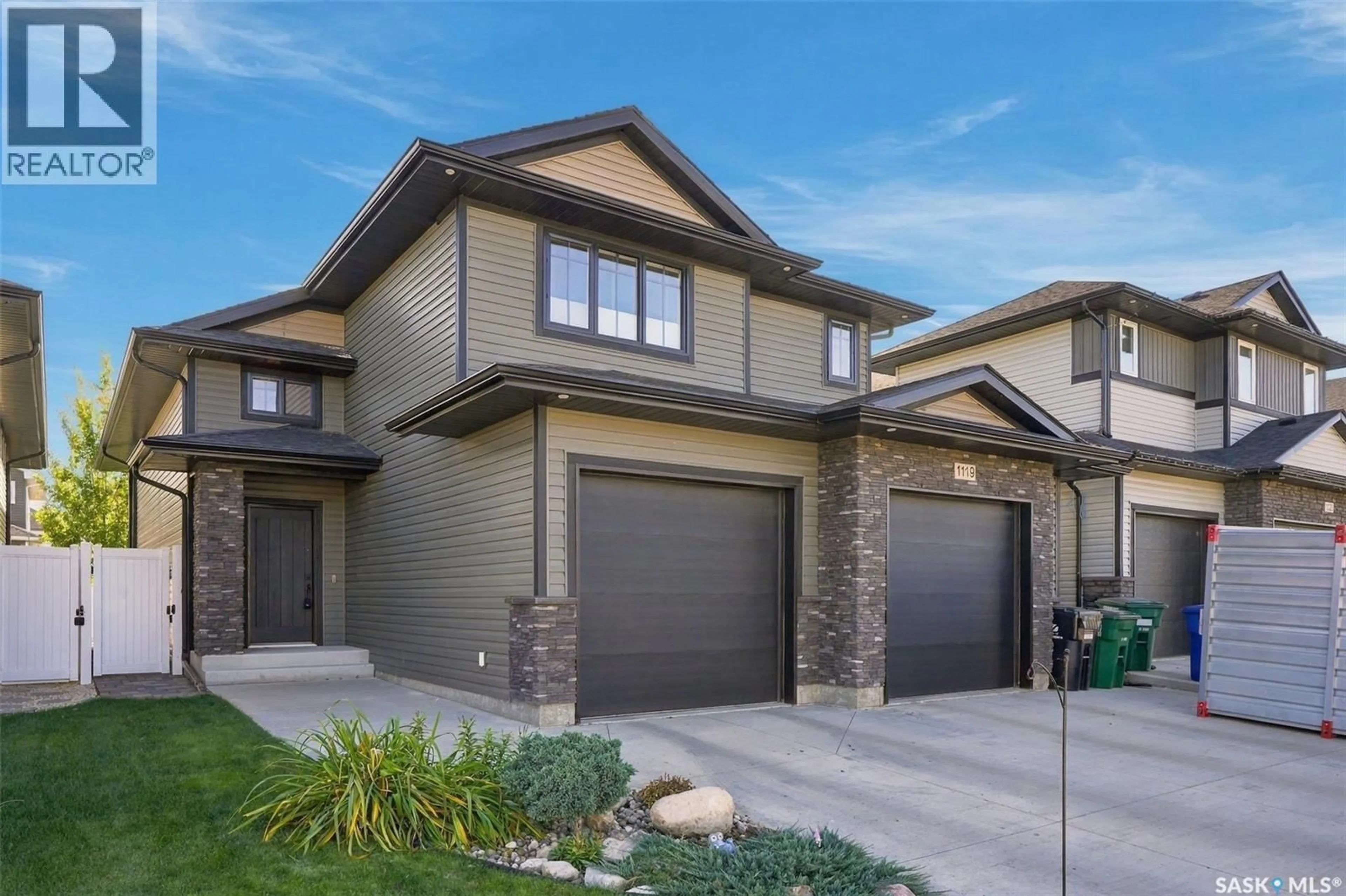 Home with brick exterior material, street for 1119 PRINGLE WAY, Saskatoon Saskatchewan S7T0V4
