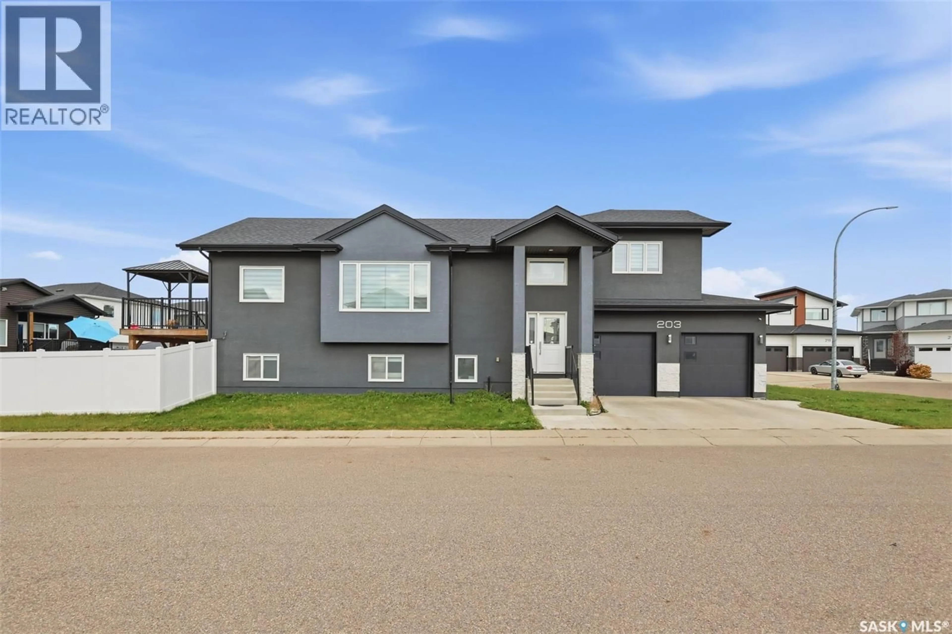 Home with vinyl exterior material, street for 203 BURGESS BAY, Saskatoon Saskatchewan S7V0S3