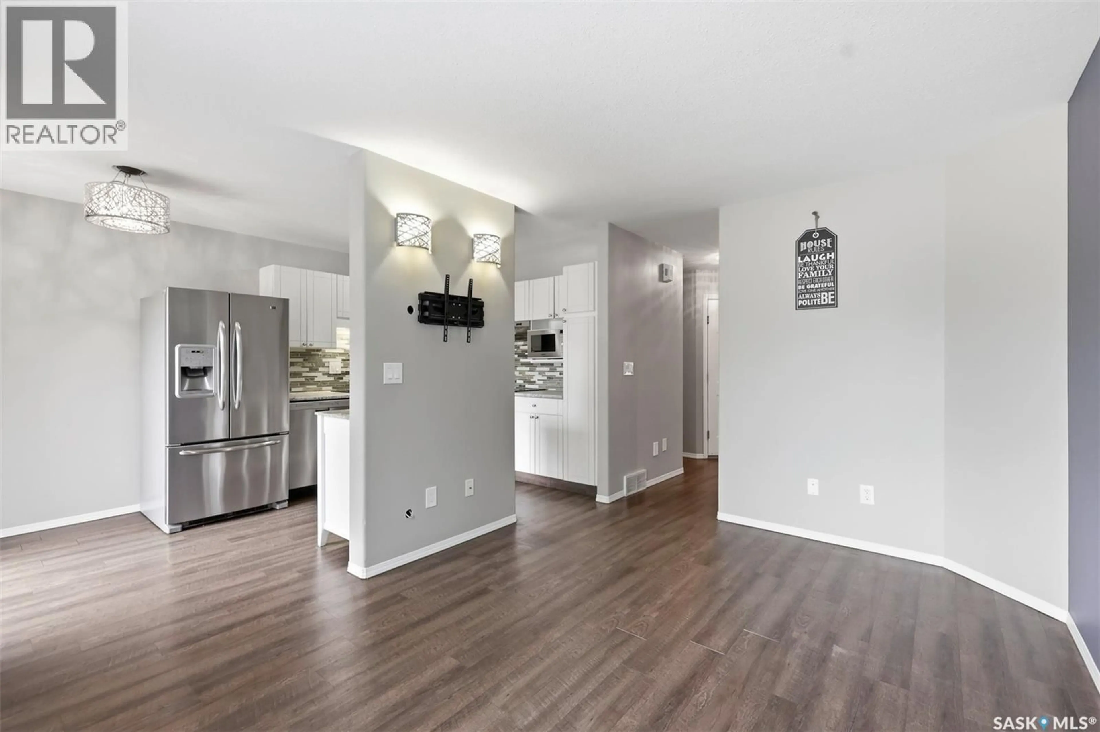 Open concept kitchen, wood/laminate floor for 8 103 BERINI DRIVE, Saskatoon Saskatchewan S7N4N2