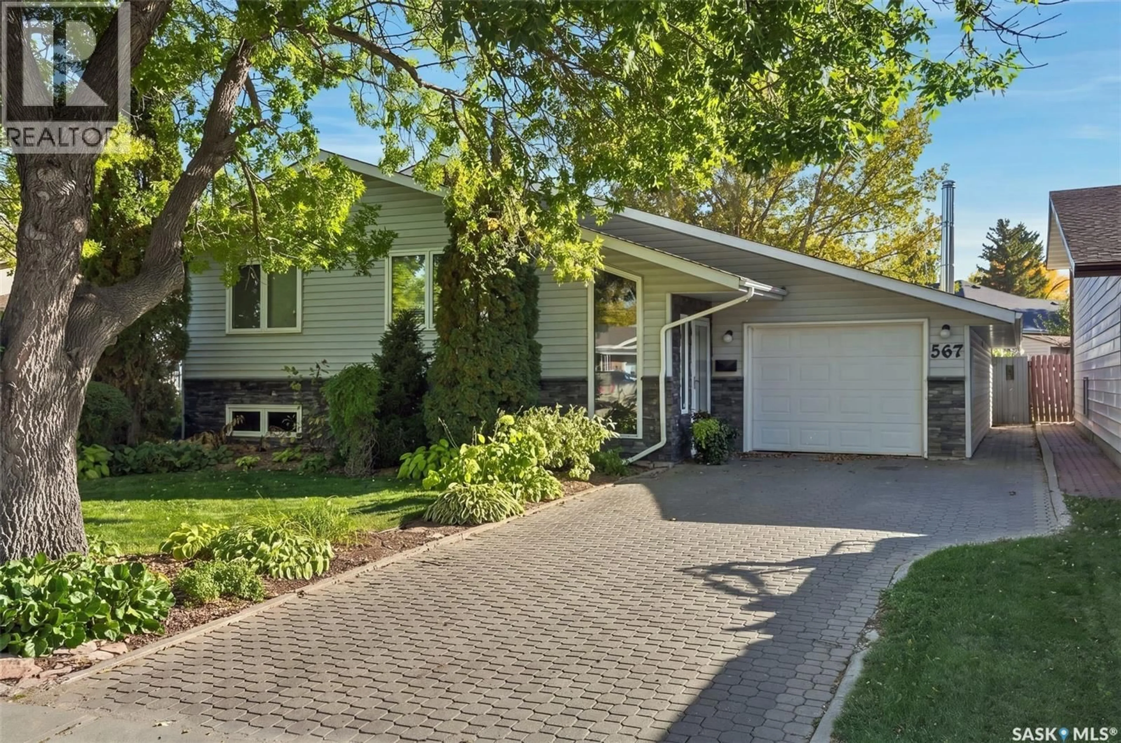 Home with vinyl exterior material, street for 567 ADILMAN DRIVE, Saskatoon Saskatchewan S7K6E8