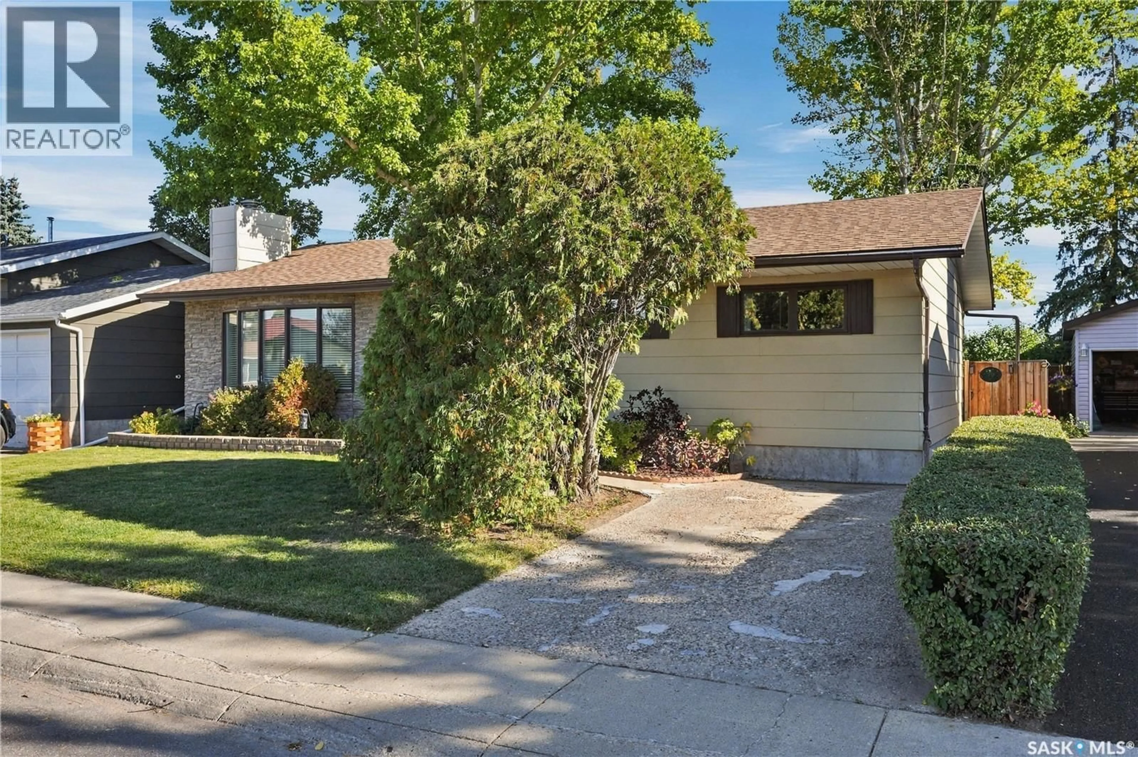 Home with vinyl exterior material, street for 222 SMITH ROAD, Saskatoon Saskatchewan S7M4Z5