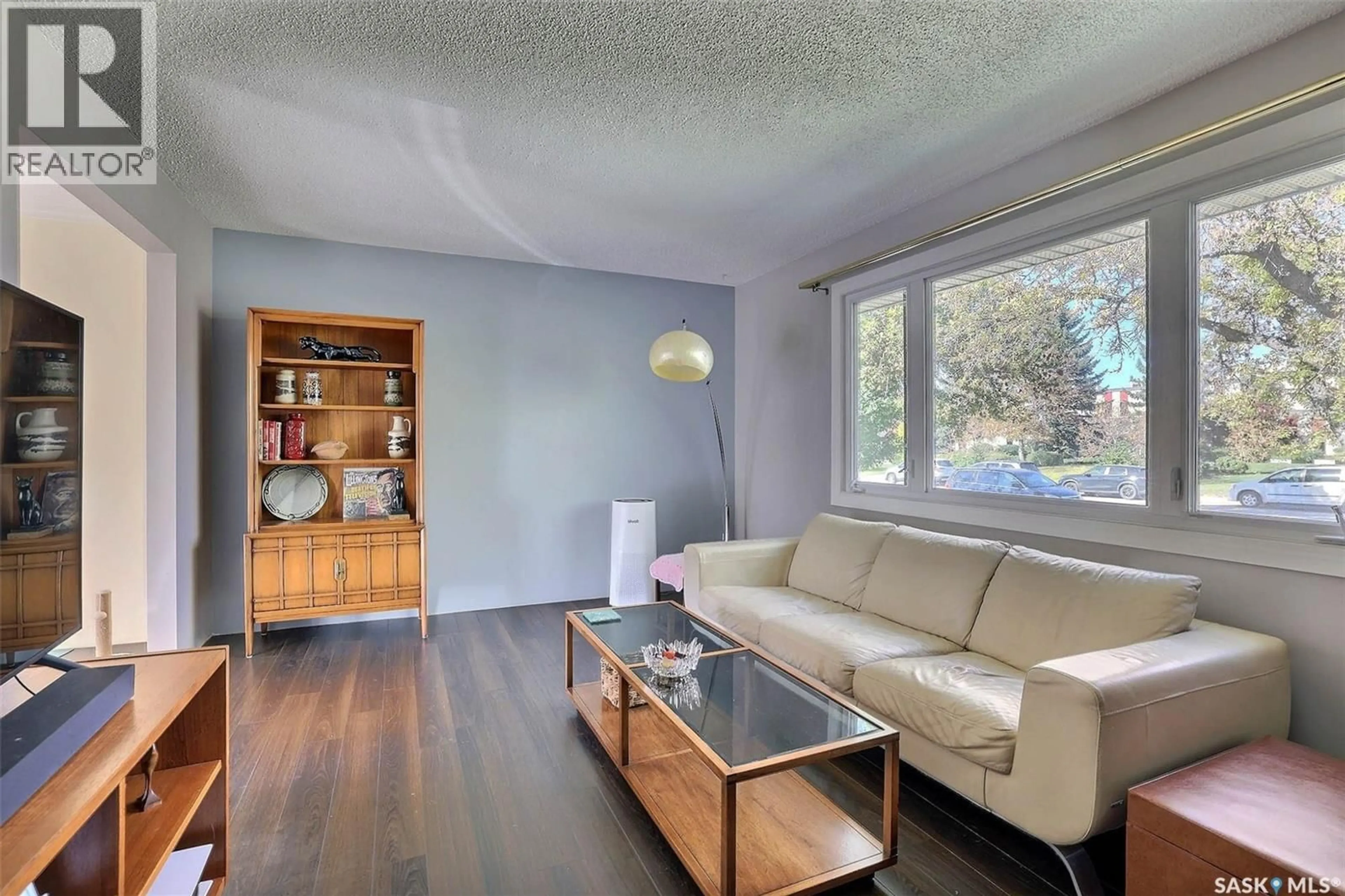 Living room with furniture, wood/laminate floor for 1425 9TH AVENUE, Regina Saskatchewan S4R0E6