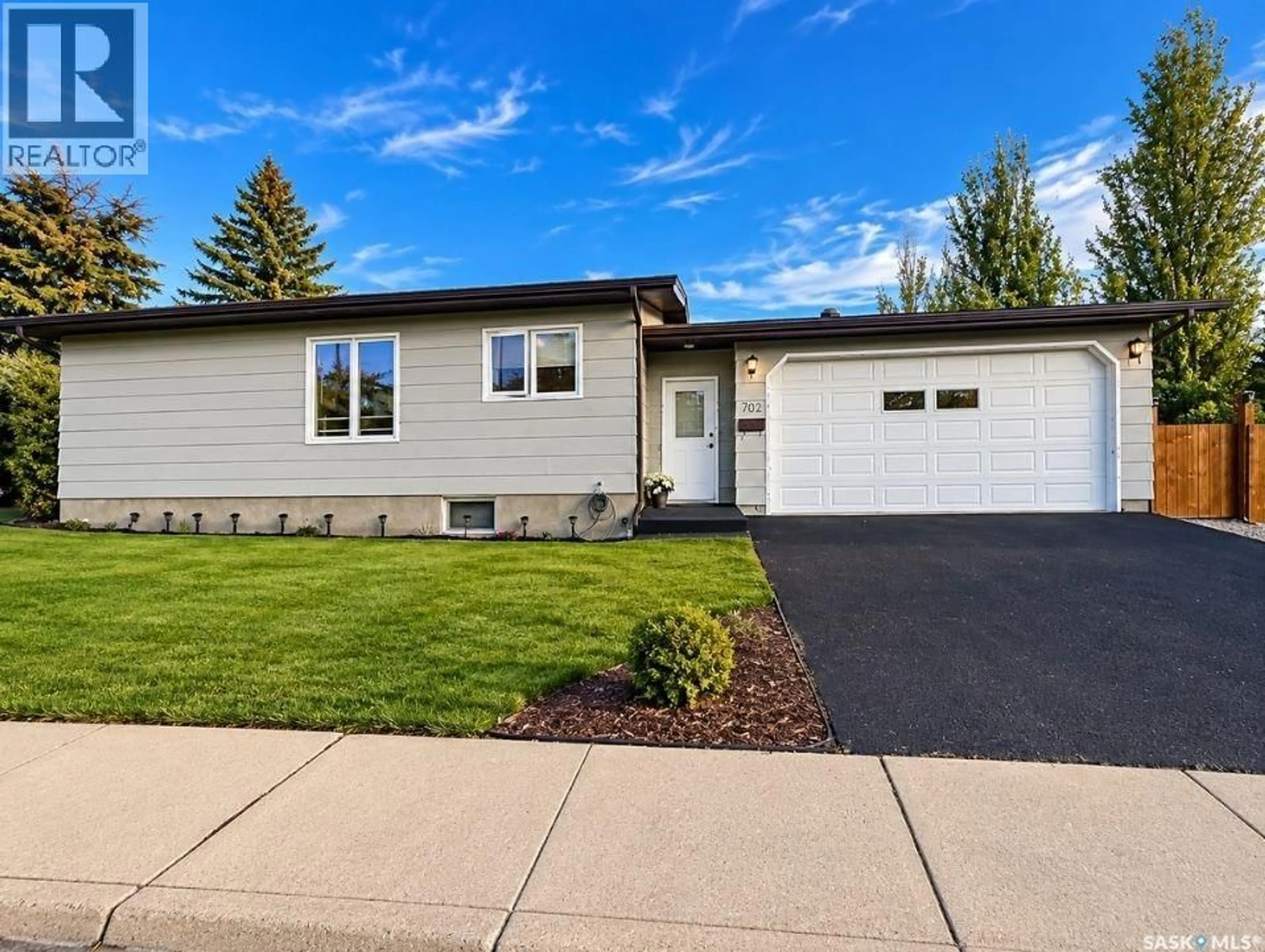 Home with vinyl exterior material, street for 302 COWIE CRESCENT, Swift Current Saskatchewan S9H4W7