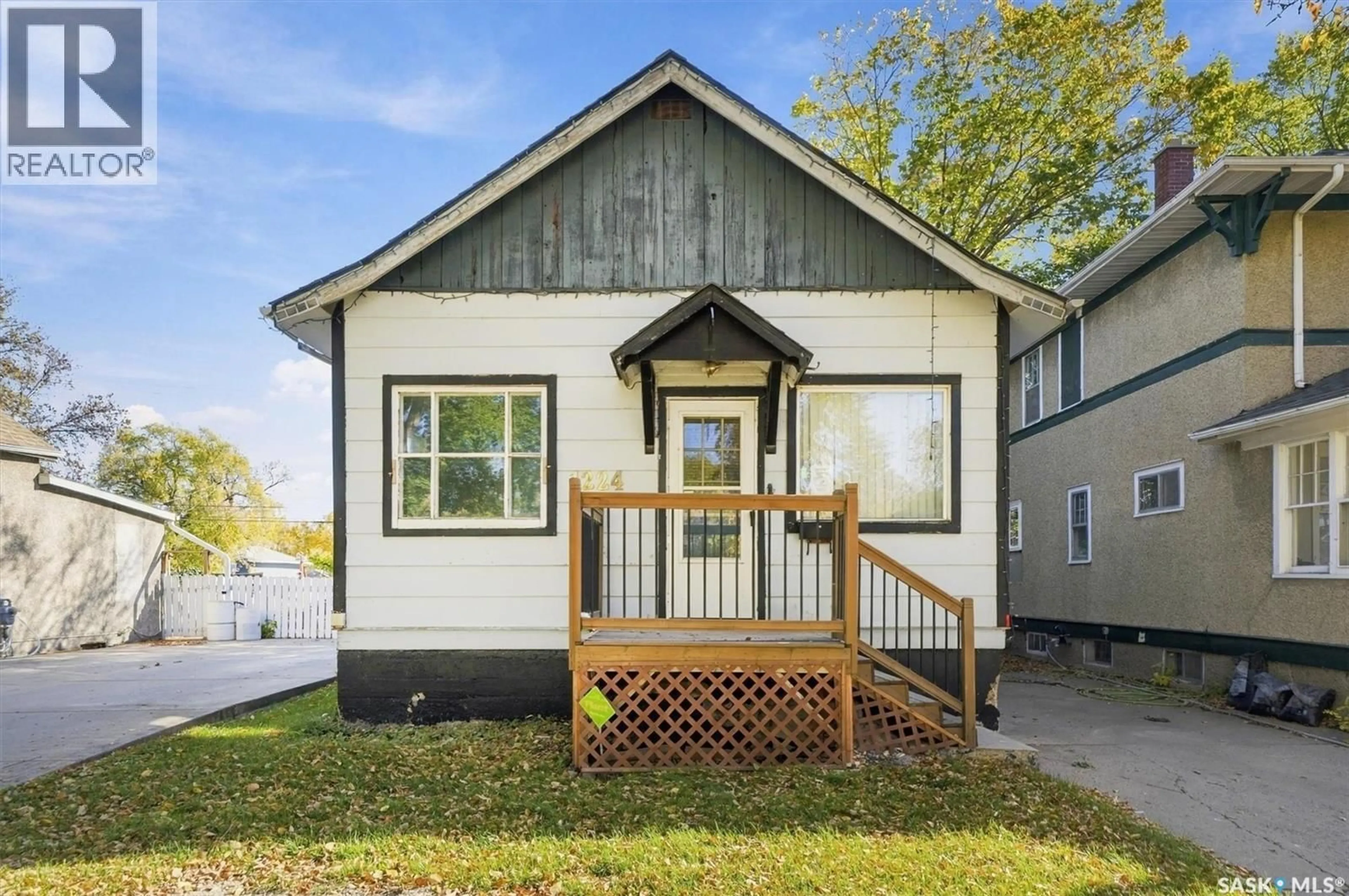 Home with vinyl exterior material, street for 1224 B AVENUE, Saskatoon Saskatchewan S7L1G3