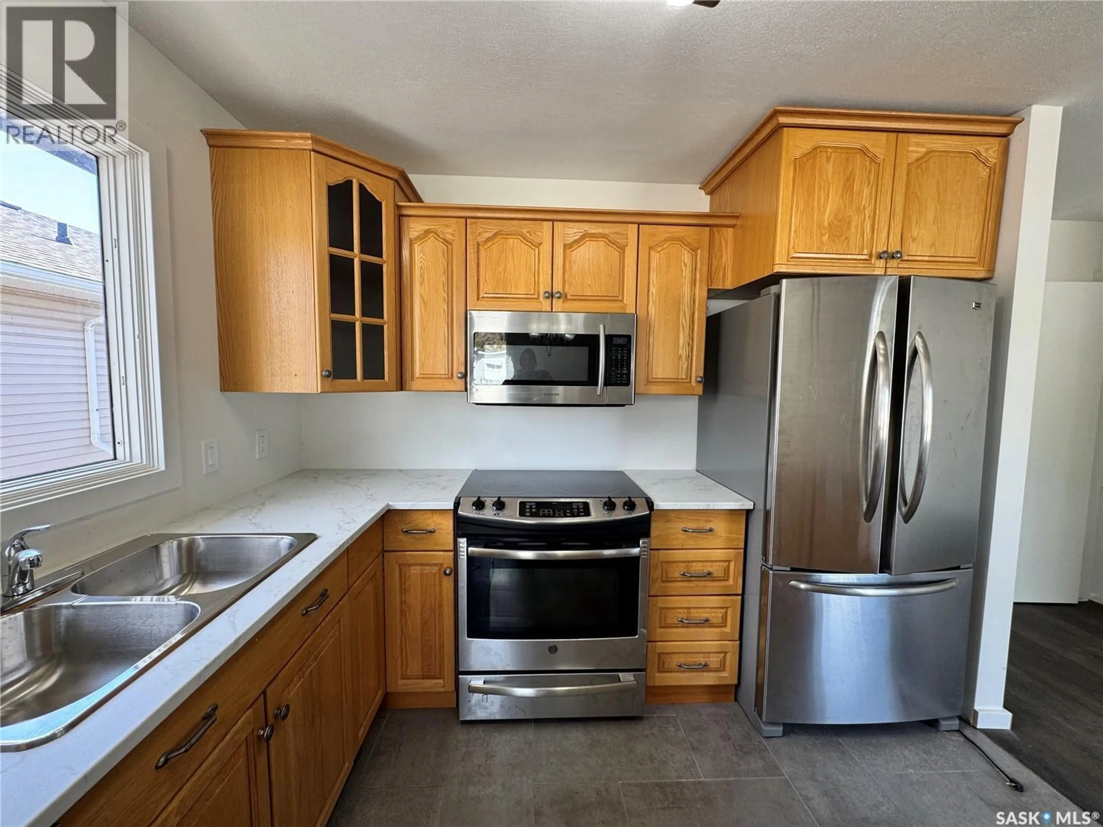 Standard kitchen, ceramic/tile floor for 218 2ND AVENUE, Biggar Saskatchewan S0K0M0