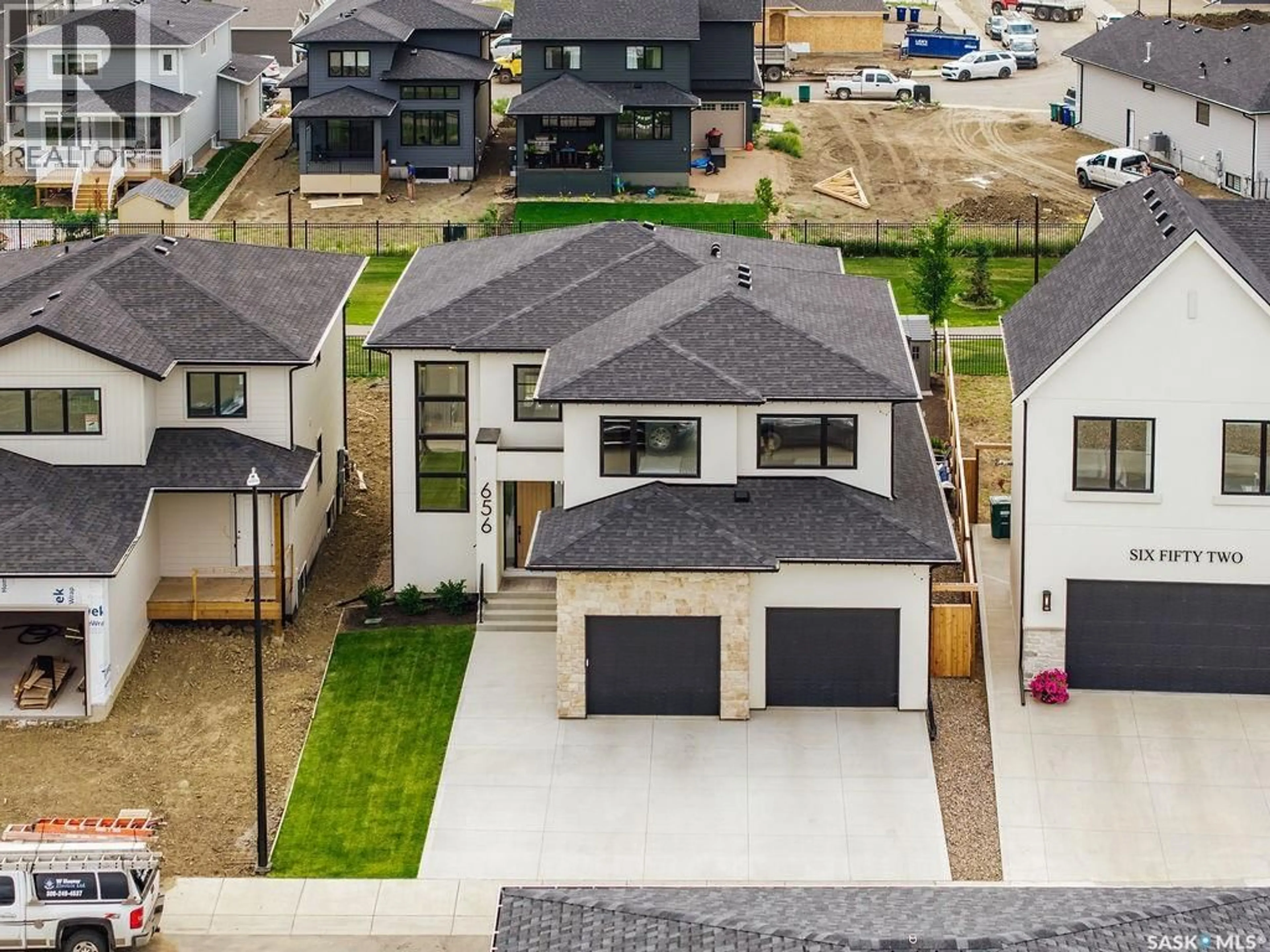 A pic from outside/outdoor area/front of a property/back of a property/a pic from drone, street for 656 PEPPER BEND, Saskatoon Saskatchewan S7V1T3