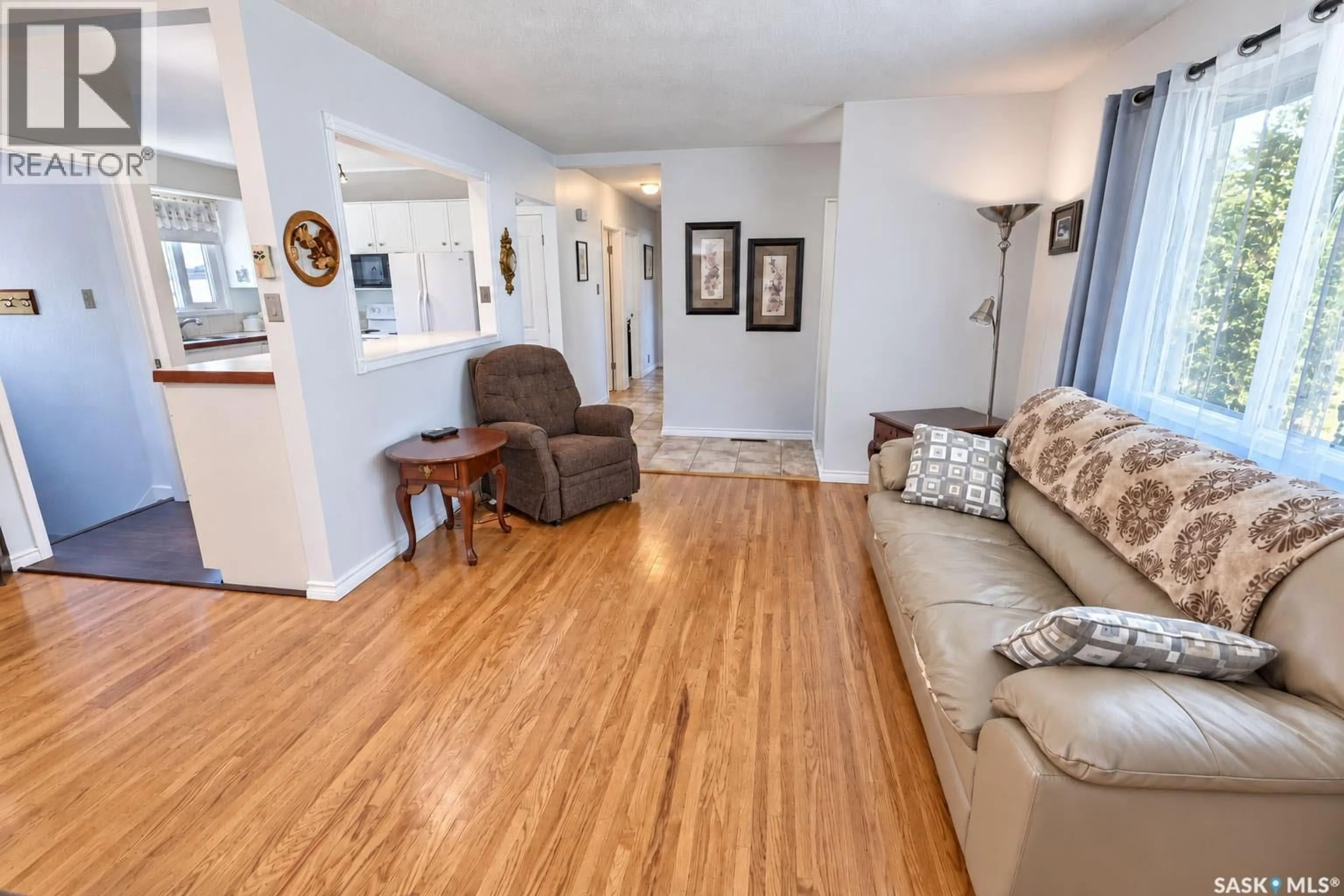 Living room with furniture, wood/laminate floor for 2338 MCDONALD AVENUE, Prince Albert Saskatchewan S6V2V6
