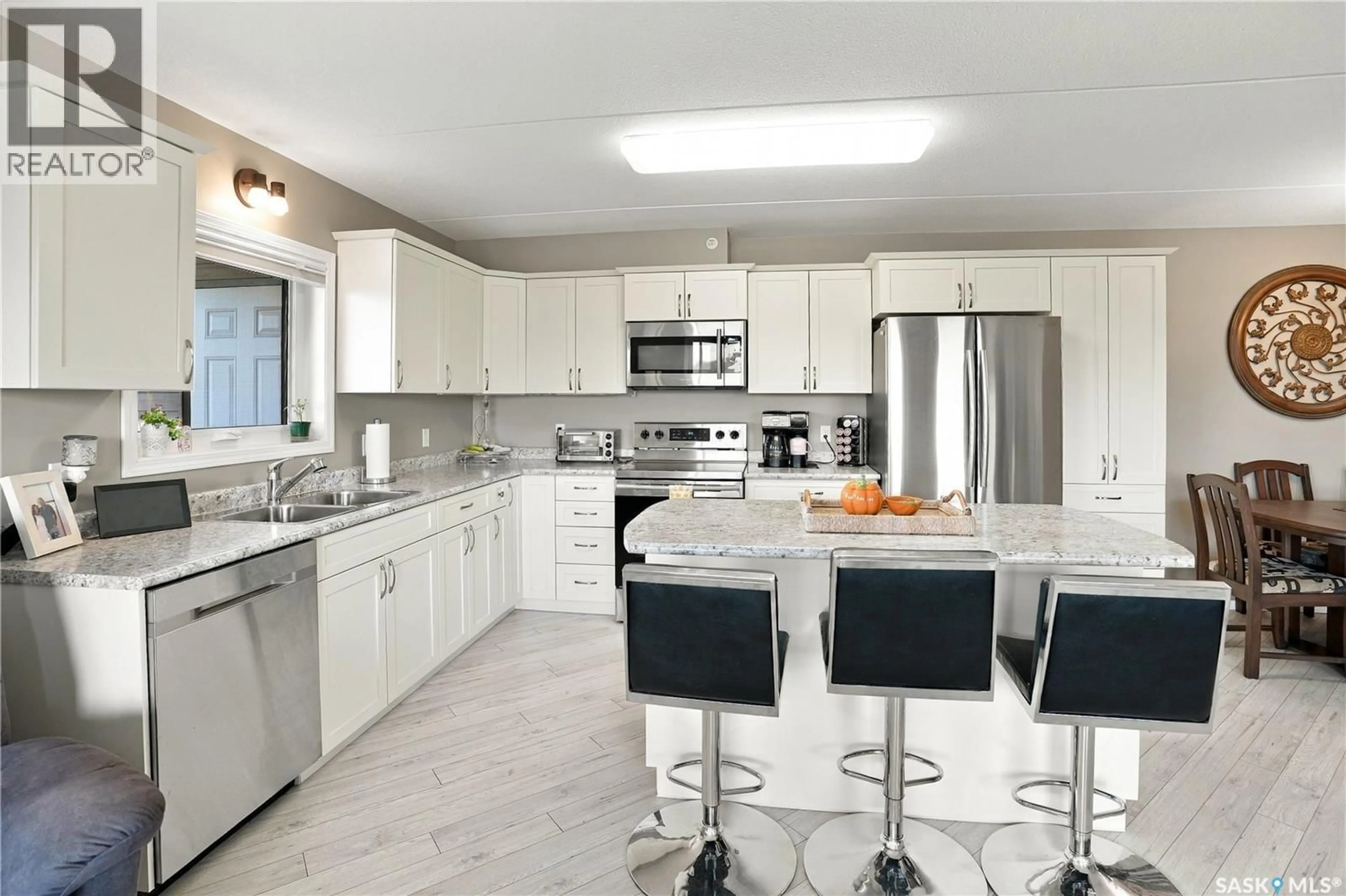 Open concept kitchen, ceramic/tile floor for 203 - 2426 BUHLER AVENUE, North Battleford Saskatchewan S9A1R5