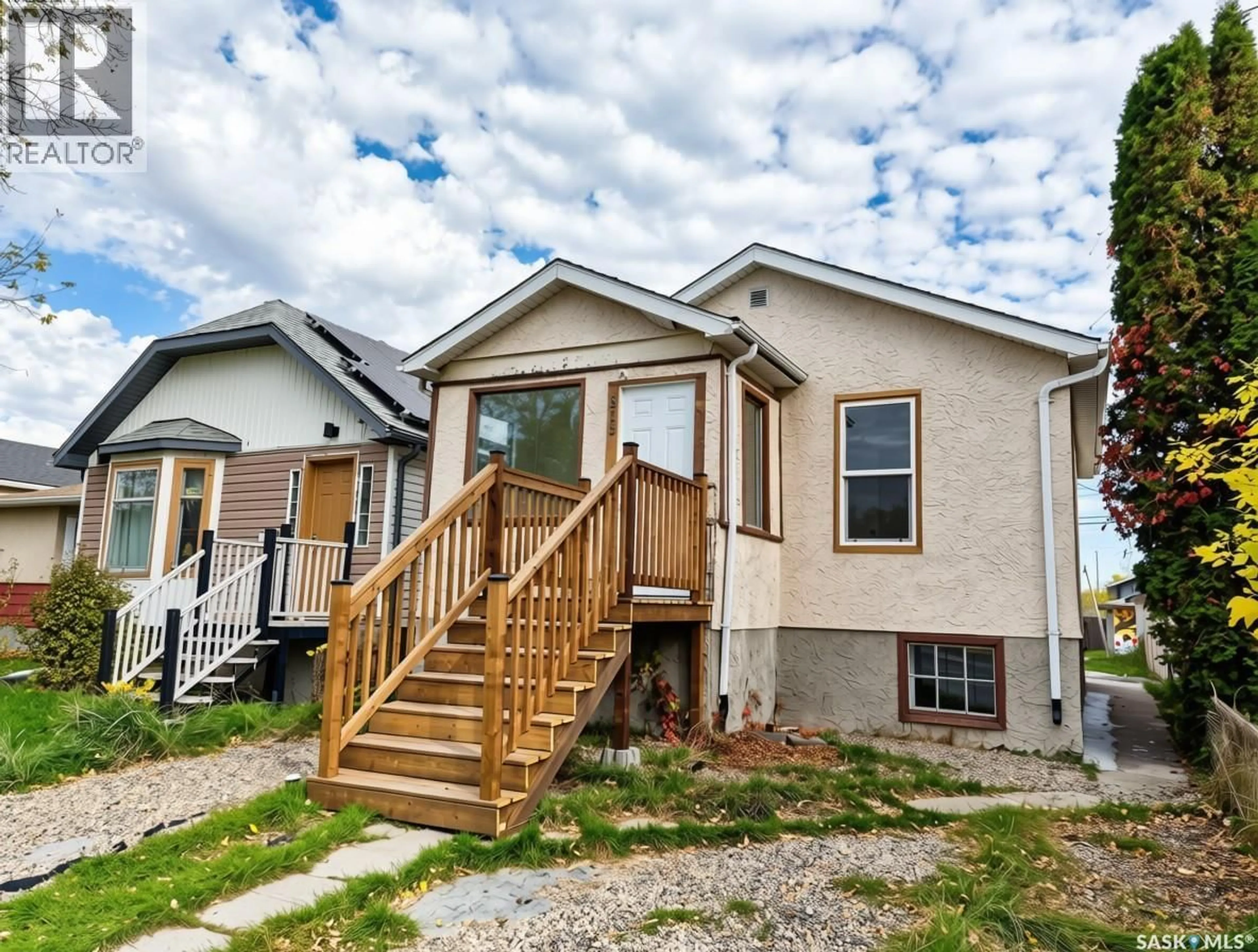 Home with vinyl exterior material, street for 815 ELPHINSTONE STREET, Regina Saskatchewan S4T3L5