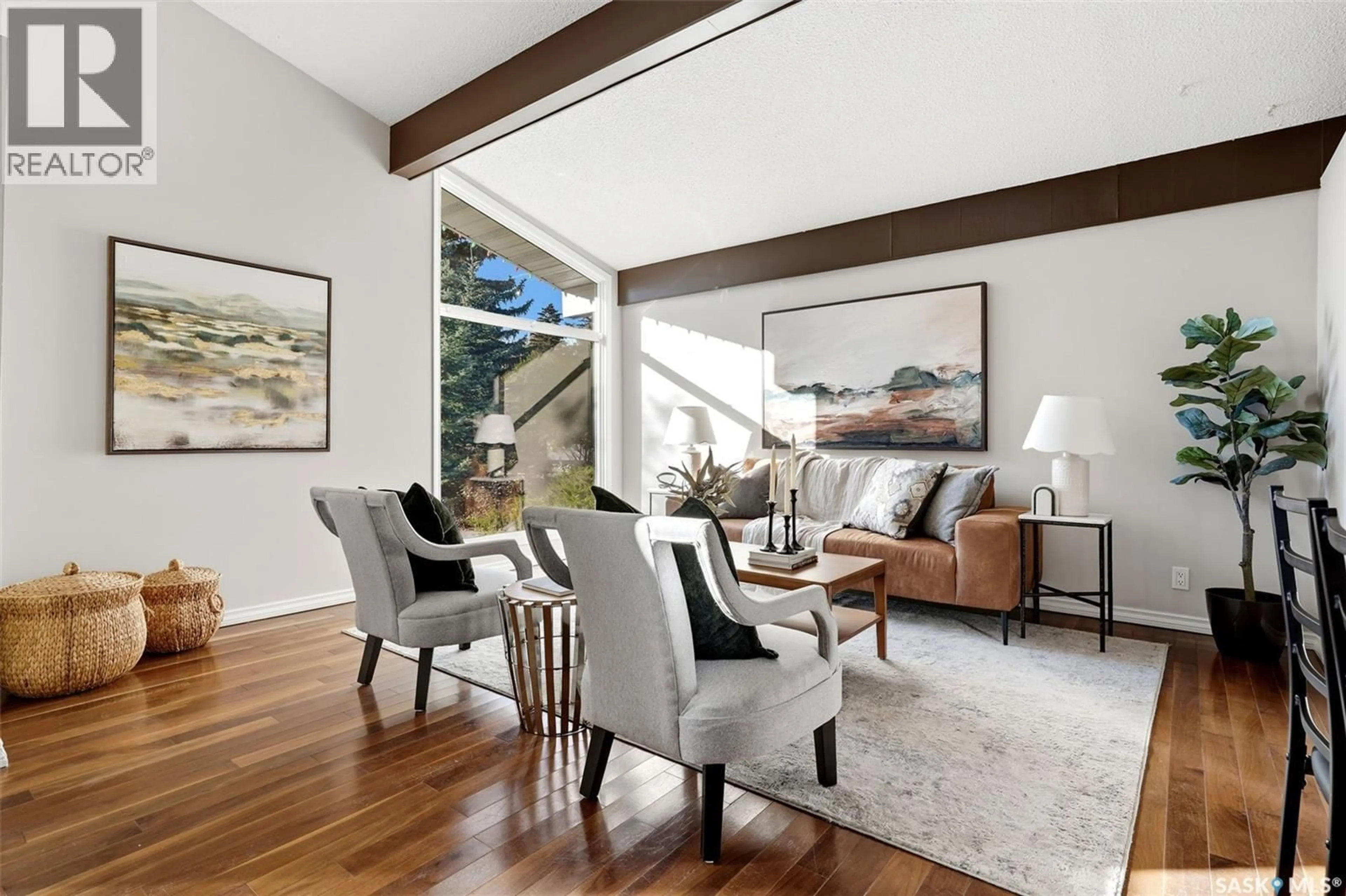 Living room with furniture, wood/laminate floor for 3361 WASCANA STREET, Regina Saskatchewan S4S2H2
