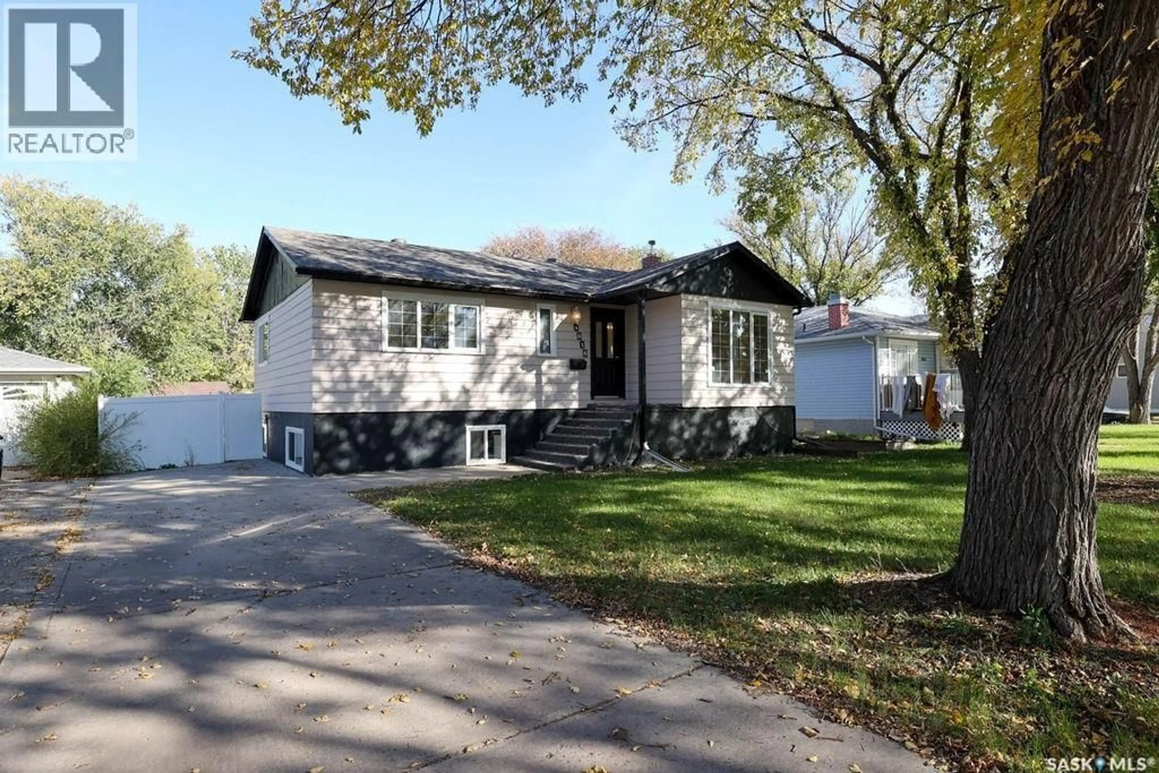 Home with vinyl exterior material, street for 4816 8TH AVENUE, Regina Saskatchewan S4T0V9