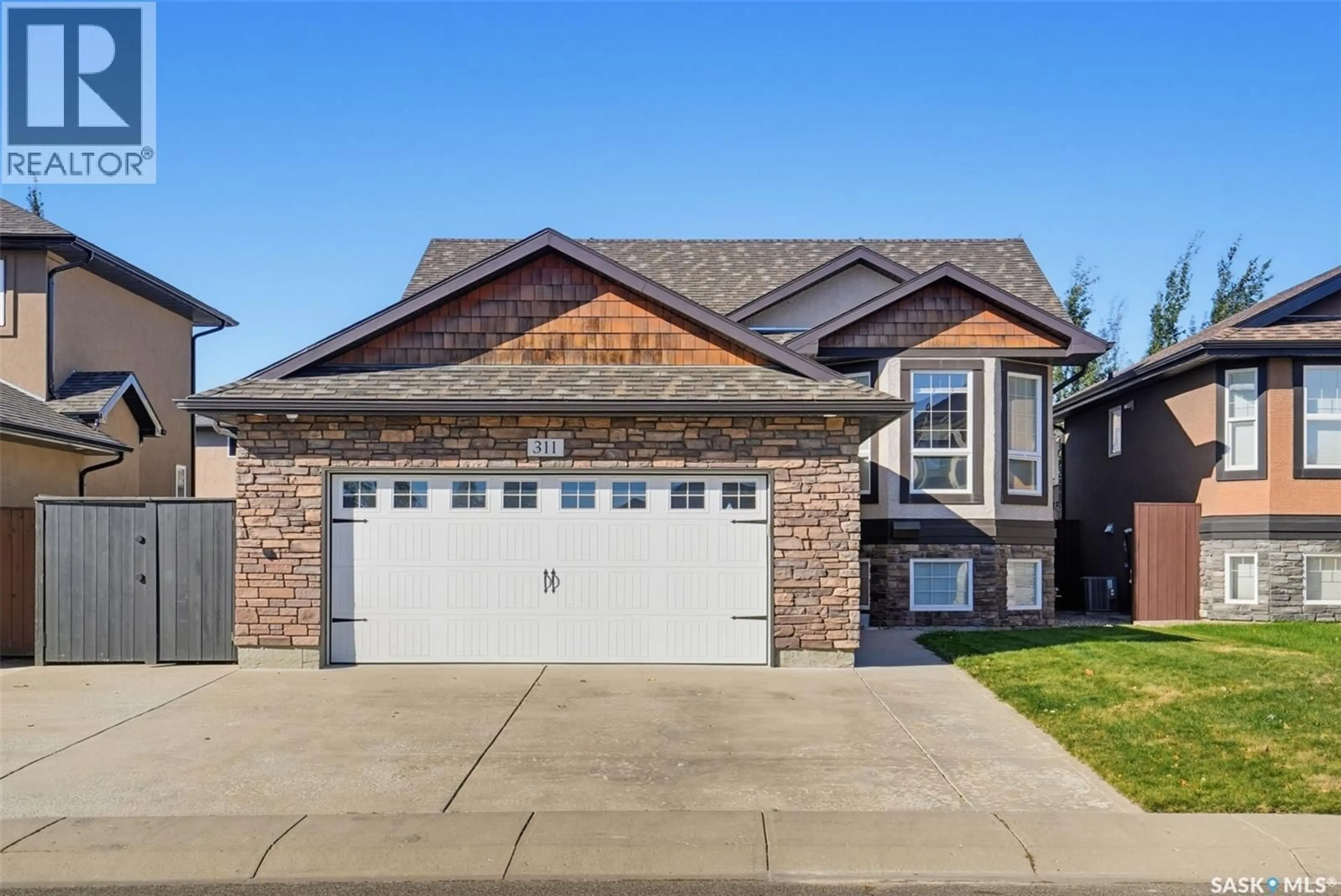 Home with brick exterior material, street for 311 BLACKSTOCK COVE, Saskatoon Saskatchewan S7T0H3