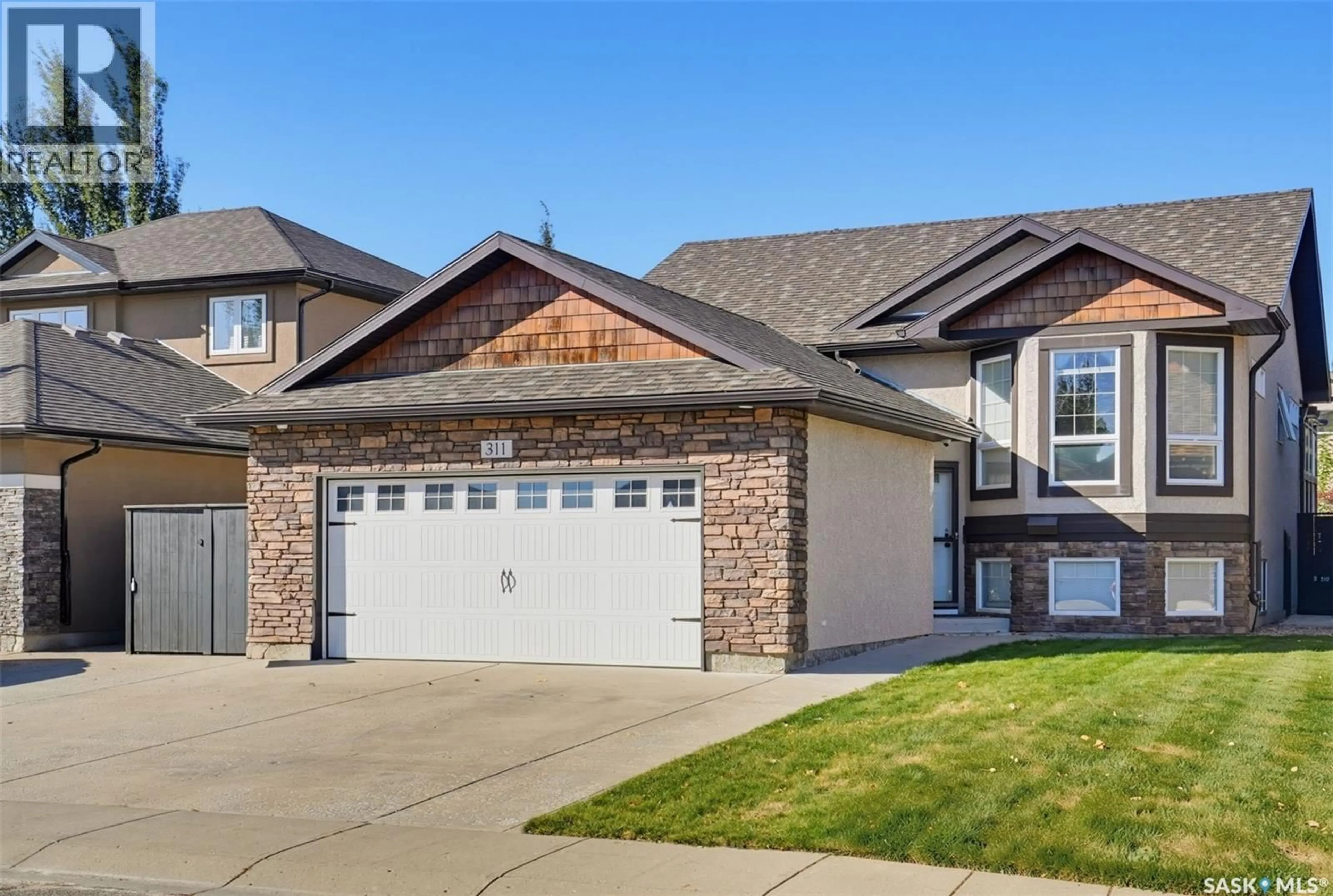 Home with brick exterior material, street for 311 BLACKSTOCK COVE, Saskatoon Saskatchewan S7T0H3