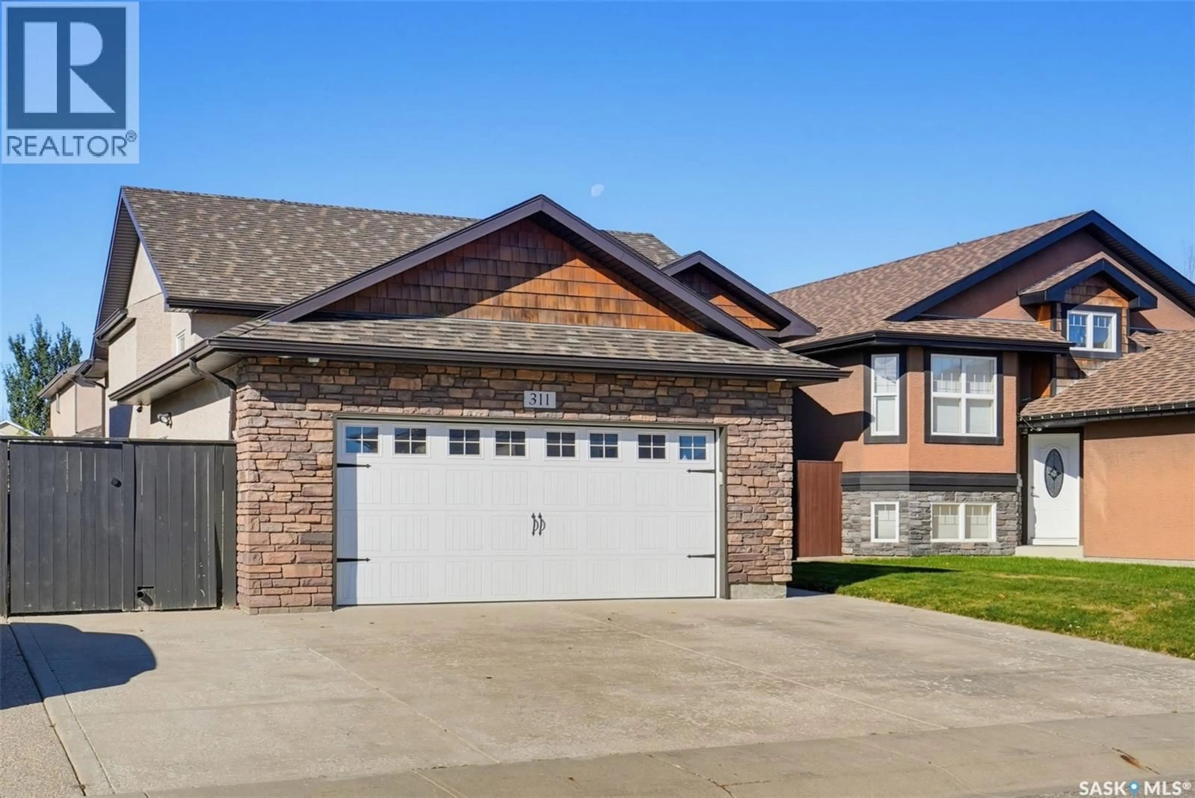 Home with brick exterior material, street for 311 BLACKSTOCK COVE, Saskatoon Saskatchewan S7T0H3