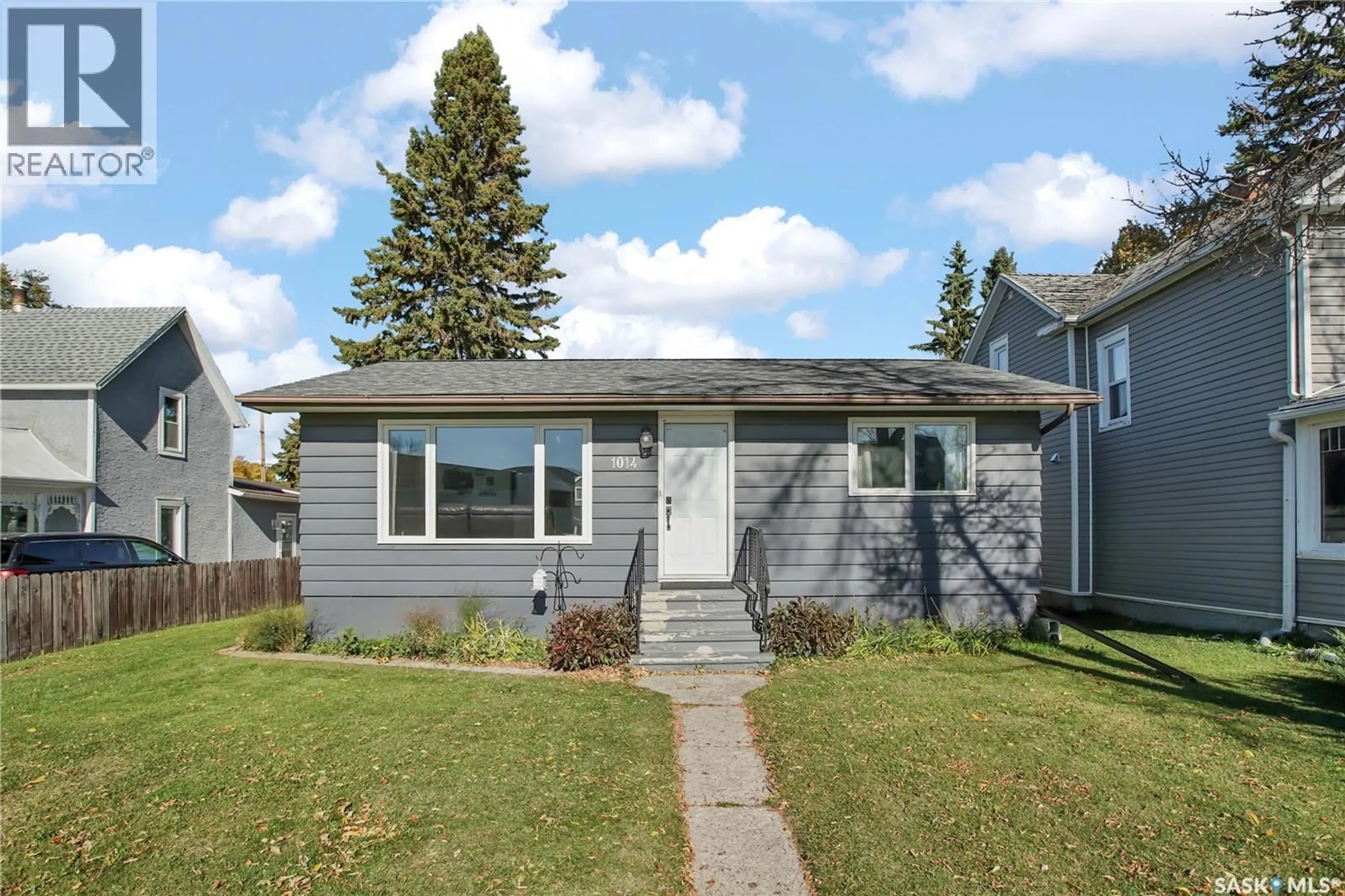 Home with vinyl exterior material, street for 1014 5TH STREET, Rosthern Saskatchewan S0K3R0