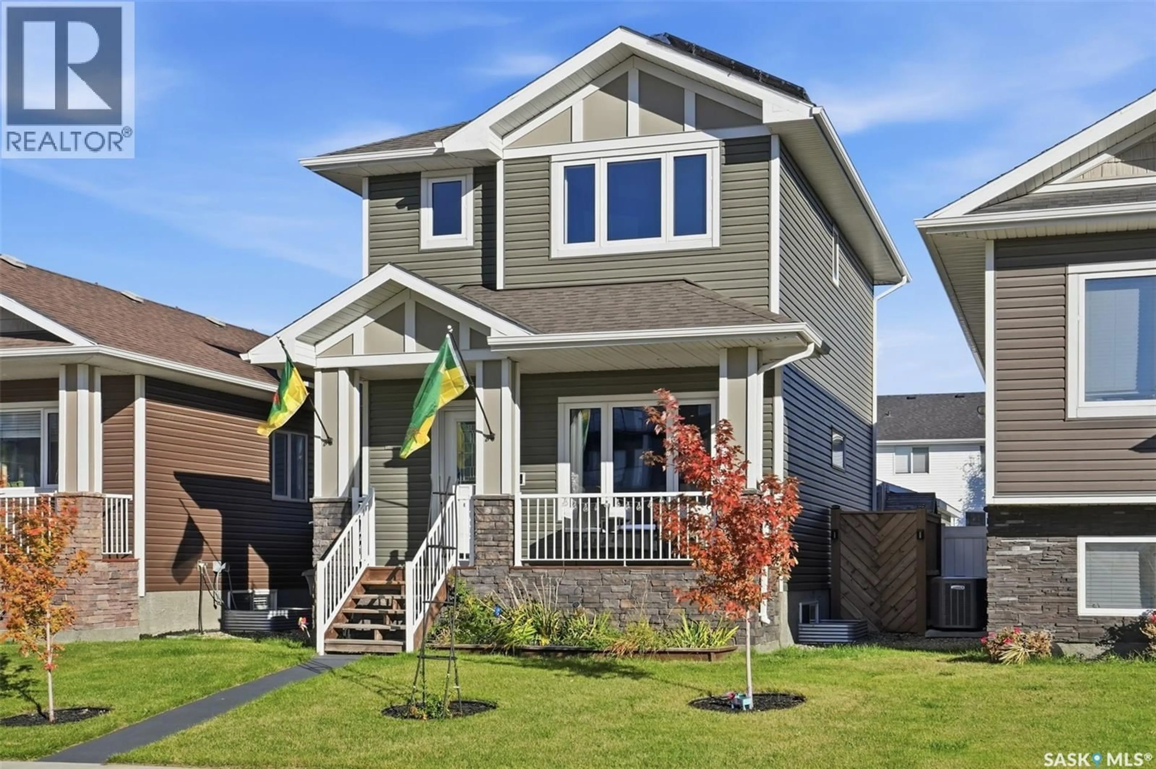 Home with vinyl exterior material, street for 1005 PARR HILL DRIVE, Martensville Saskatchewan S0K2T1