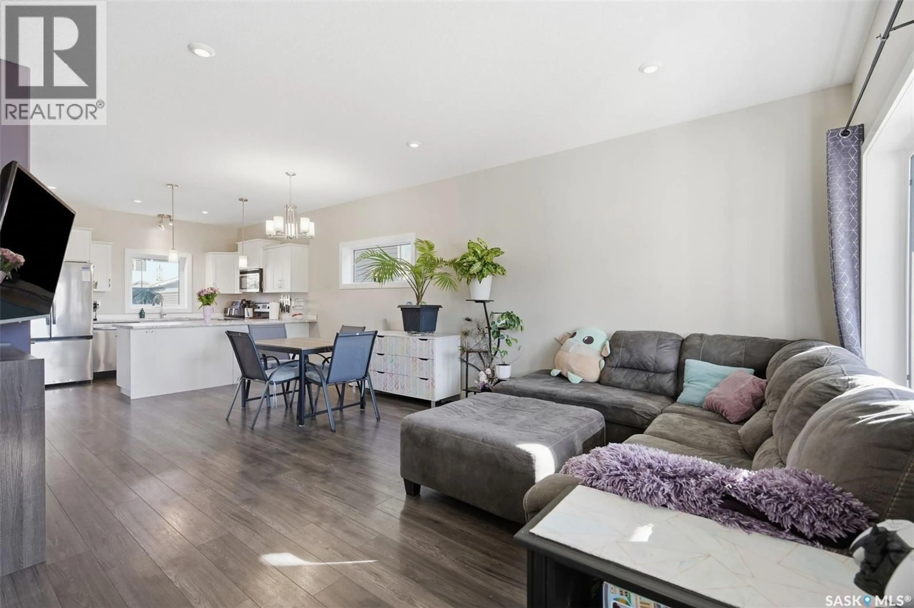 Living room with furniture, wood/laminate floor for 1005 PARR HILL DRIVE, Martensville Saskatchewan S0K2T1