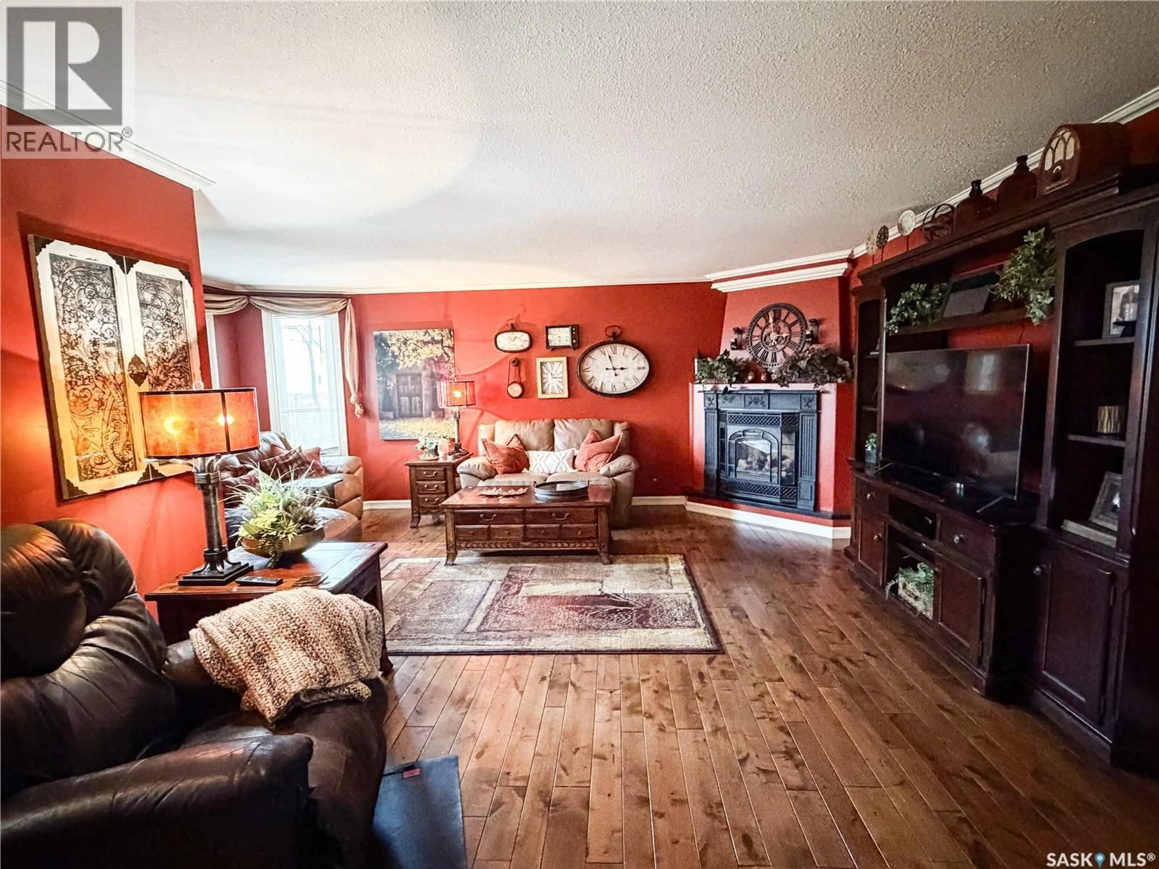 Living room with furniture, wood/laminate floor for 101 2ND AVENUE, Pierceland Saskatchewan S0M2K0