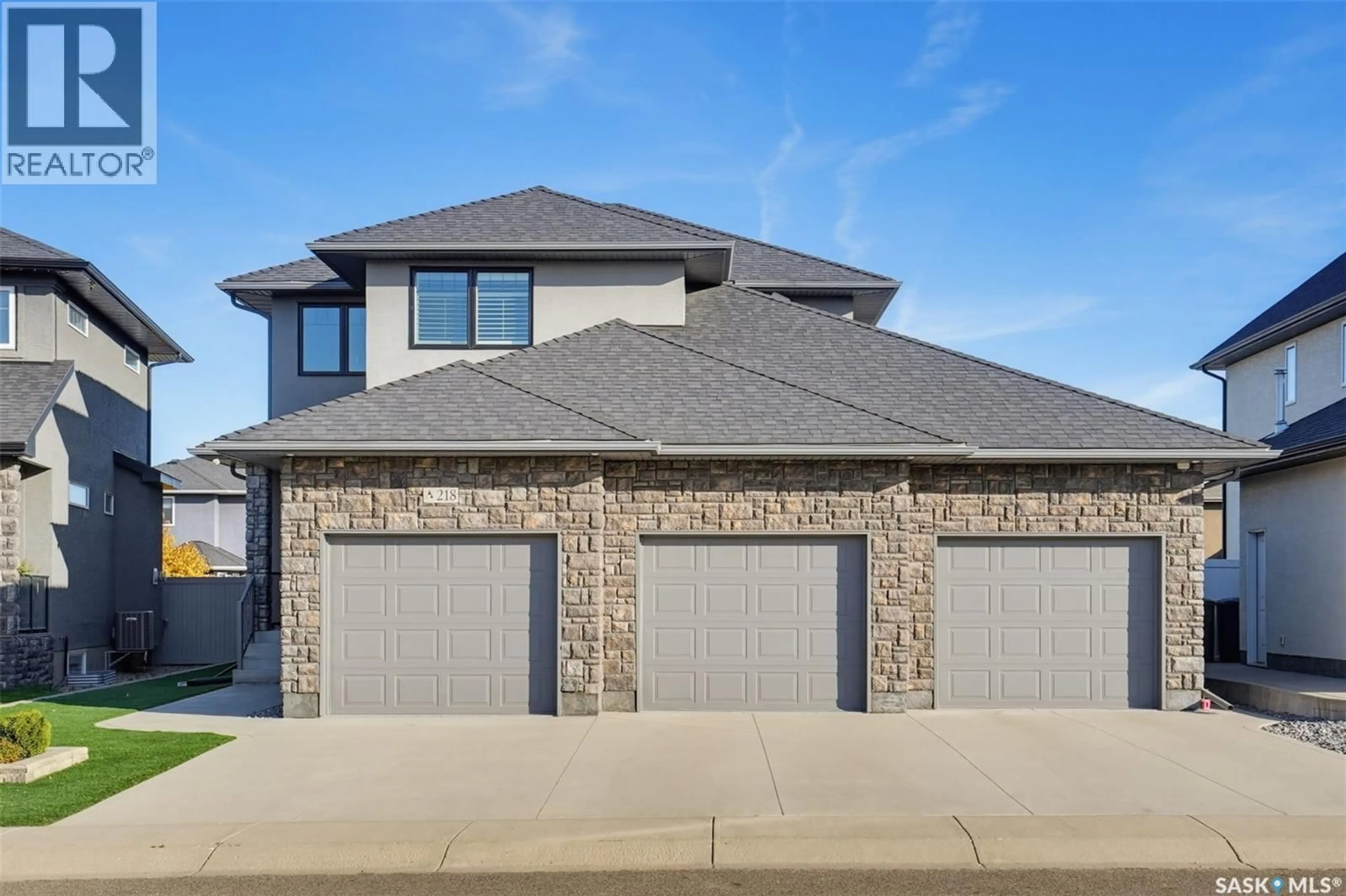 Home with brick exterior material, street for 218 WARDER COVE, Saskatoon Saskatchewan S7T0P7