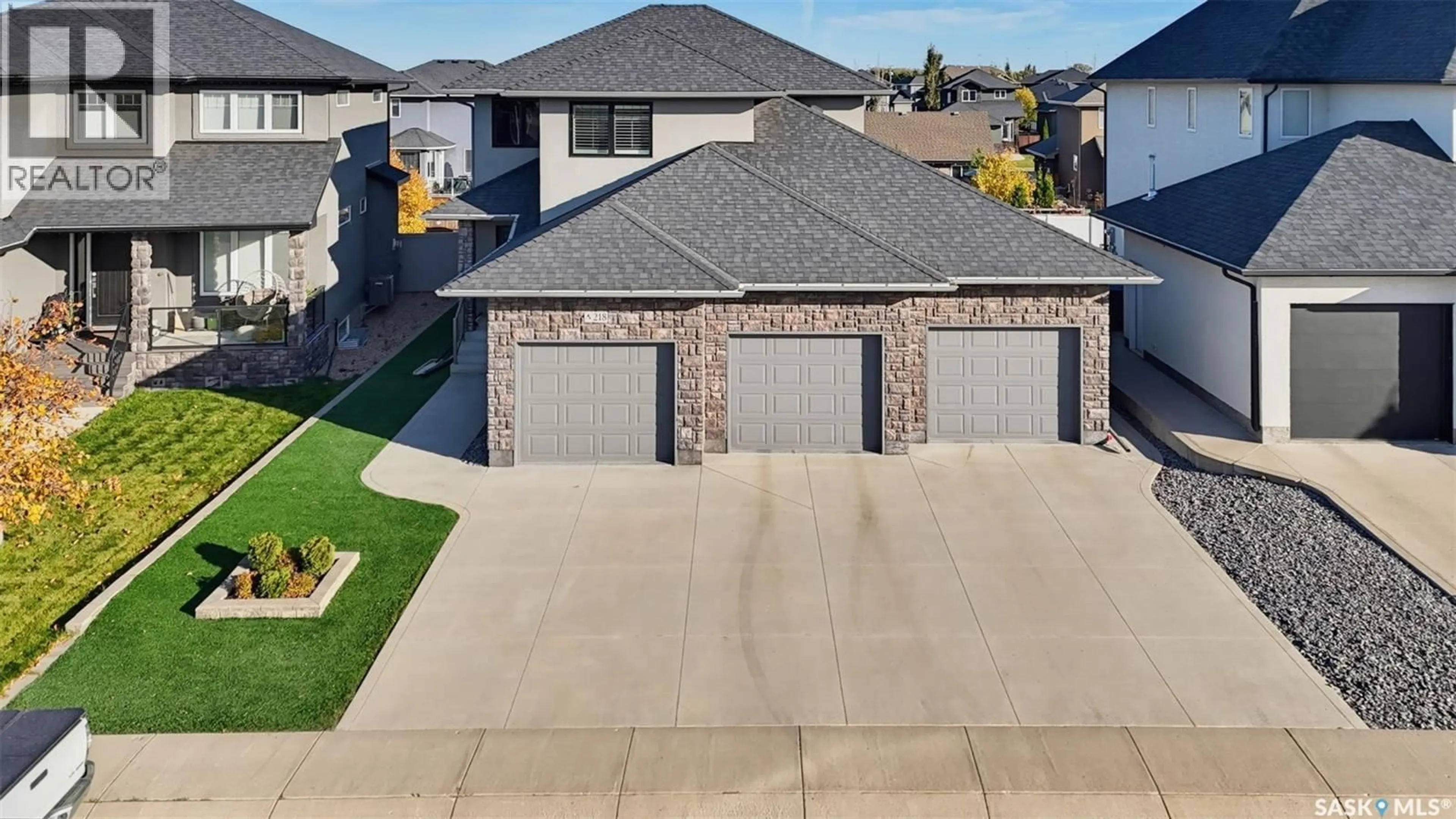 A pic from outside/outdoor area/front of a property/back of a property/a pic from drone, street for 218 WARDER COVE, Saskatoon Saskatchewan S7T0P7