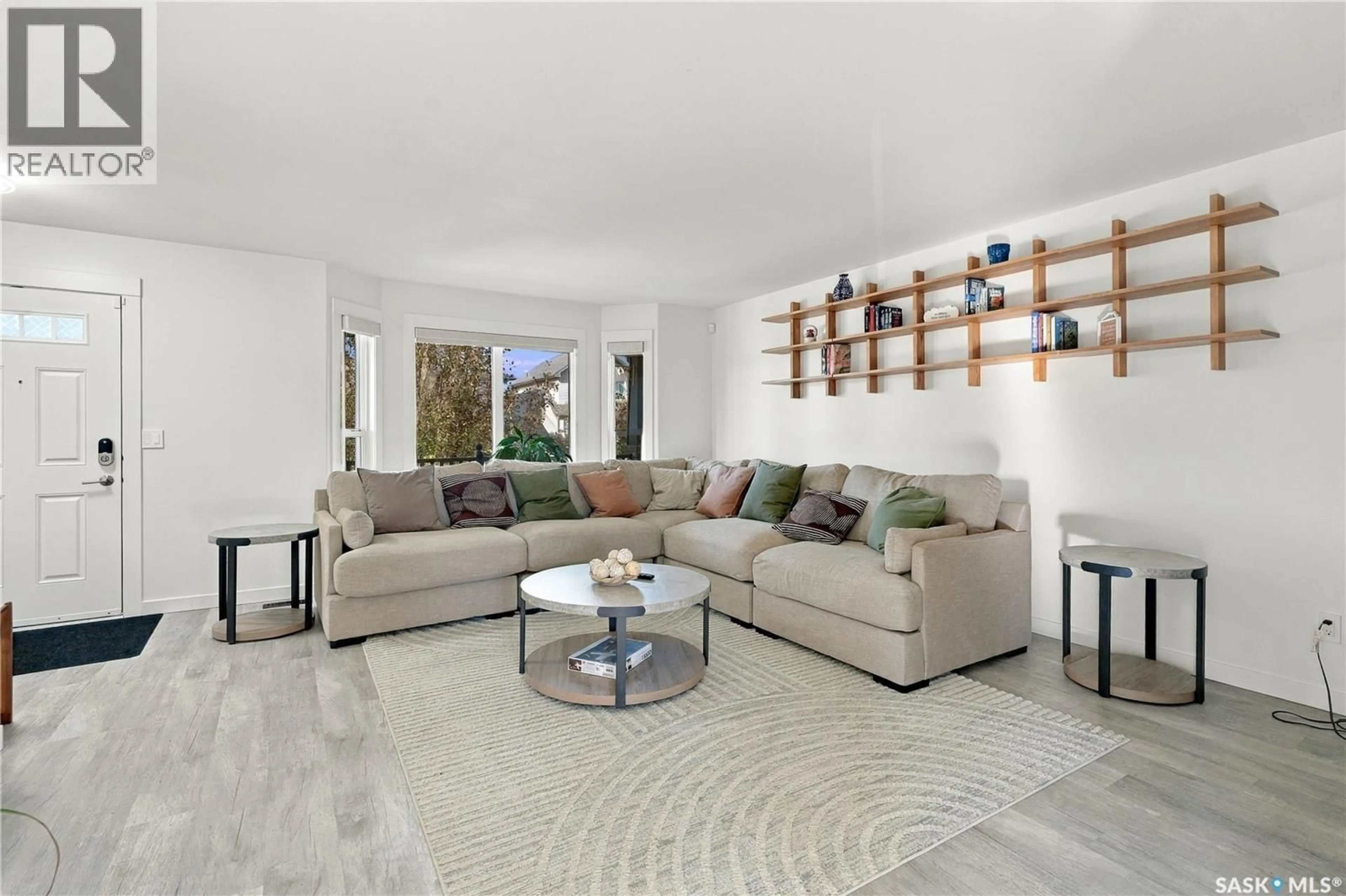 Living room with furniture, ceramic/tile floor for 302 GORDON ROAD, Saskatoon Saskatchewan S7T0A3