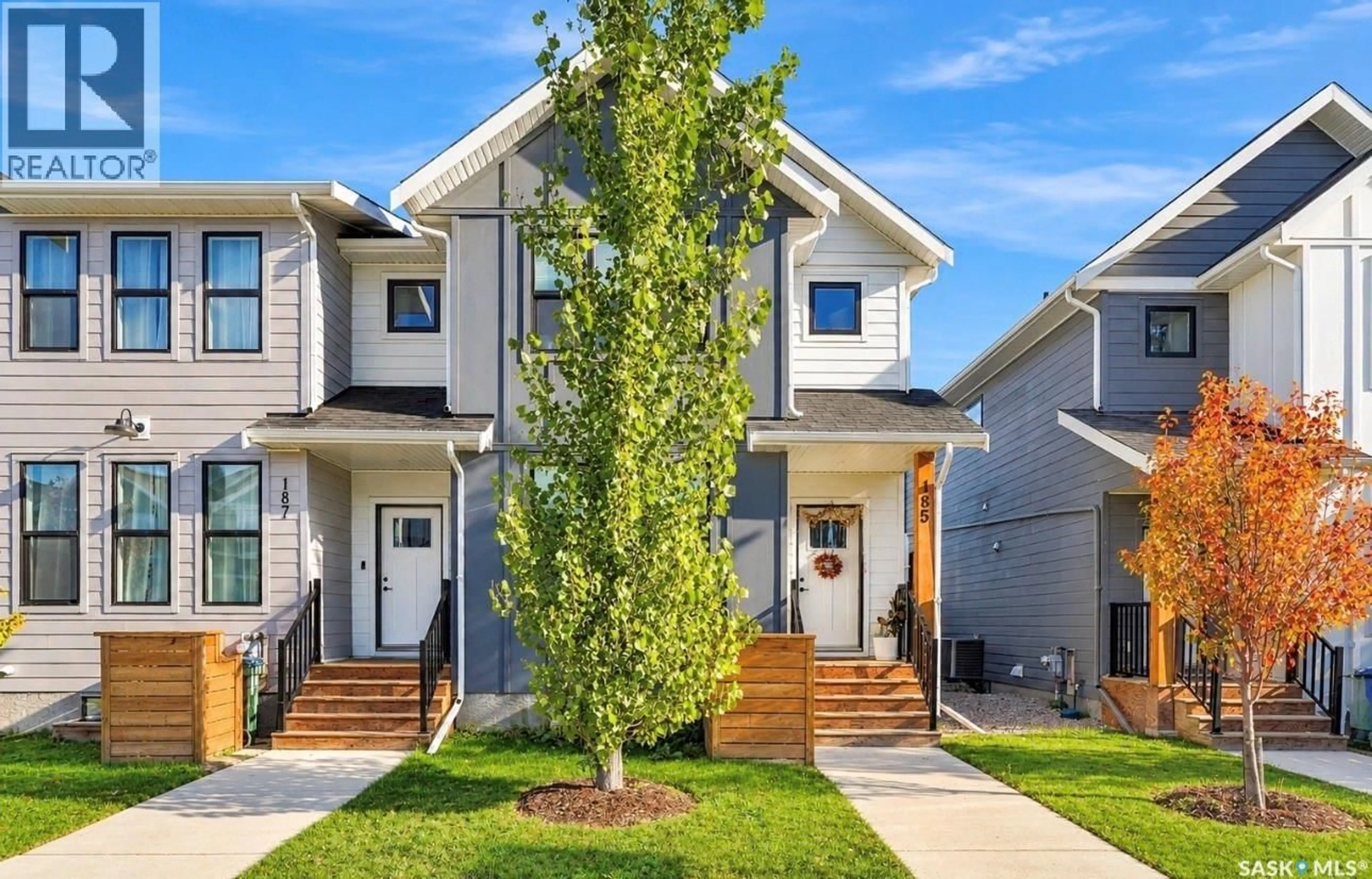 Home with vinyl exterior material, street for 185 ROSEWOOD BOULEVARD, Saskatoon Saskatchewan S7V0X2